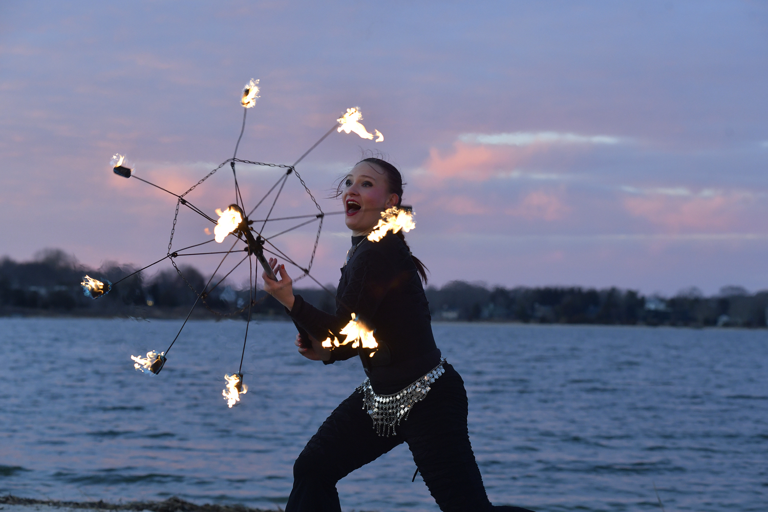 Fire dancer Anna Archaic performs with Keith Leaf and His Flaming Friends.