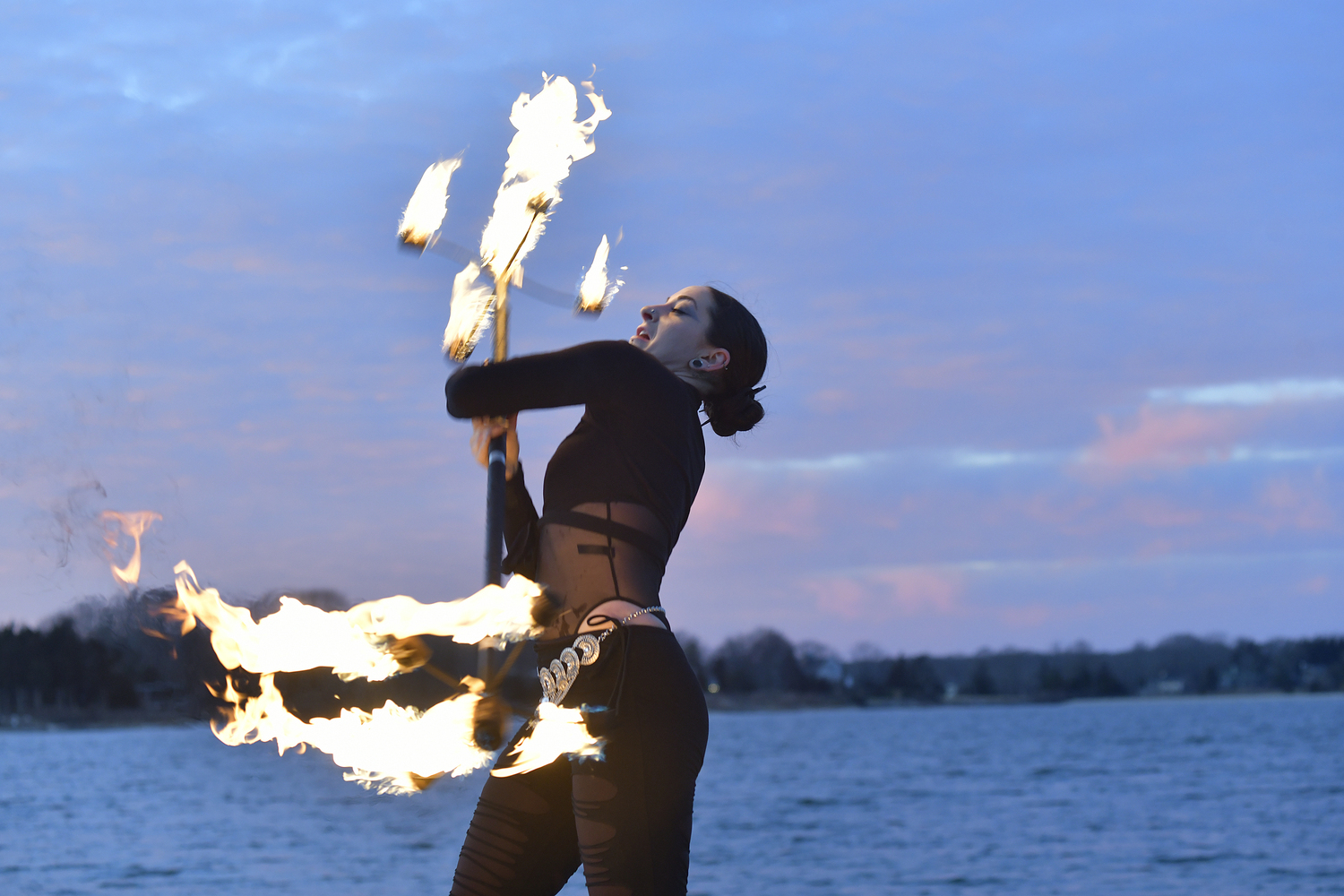 Fire dancer Christy Belle performs with Keith Leaf and His Flaming Friends.