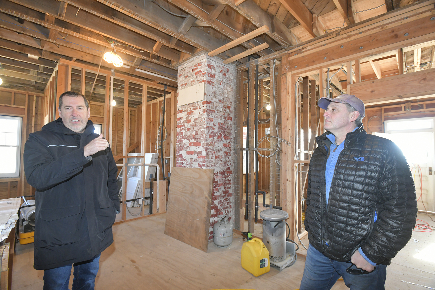 Matthew Jedlicka, consulting engineer with LK McLean Associates and John Ferguson, electrical contractor in the Tiana Lifesaving Station.  DANA SHAW