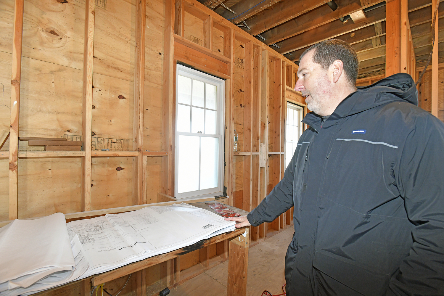 Matthew Jedlicka, consulting engineer with LK McLean Associates with the plans for the lifesaving station.  DANA SHAW