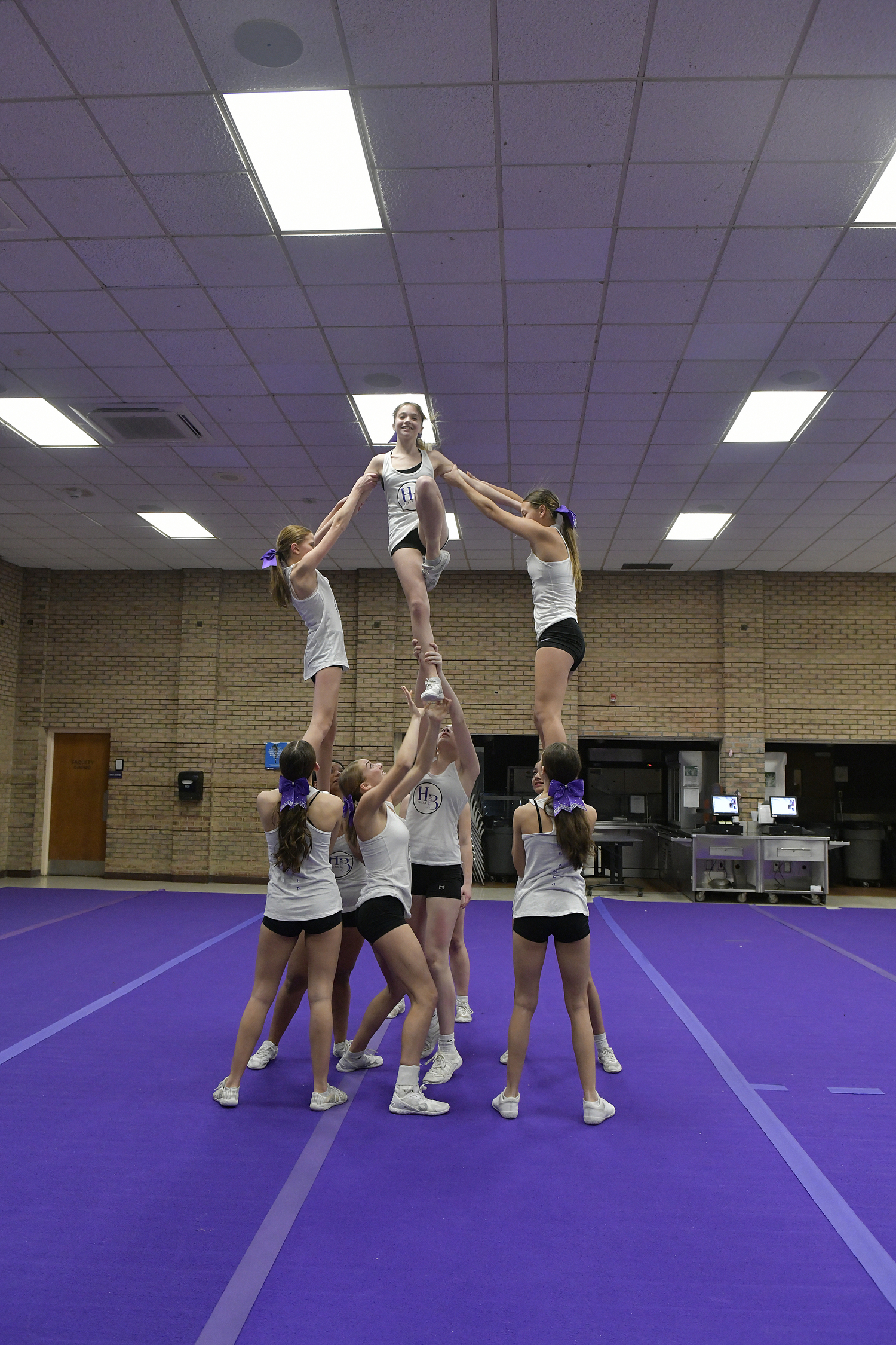 The Hampton Bays High School competitive cheerleading team at practice on February 9. For the first time since 2020, the team has advanced and qualified for the Suffolk County Championship on February 17.   DANA SHAW