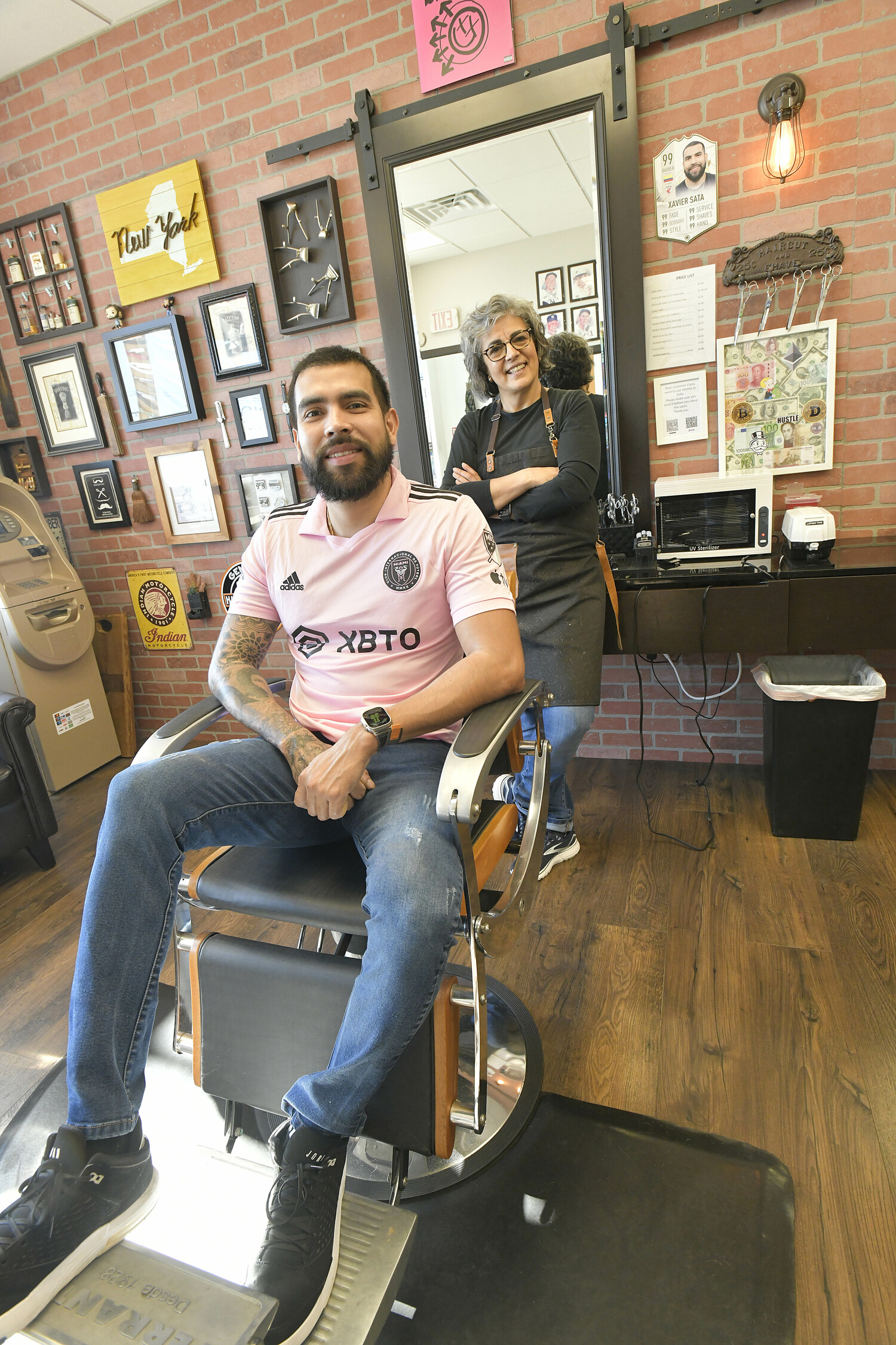 Javier Sanchez and Ana Maria Anselmo at Giorgio's Barber Shop.  DANA SHAW