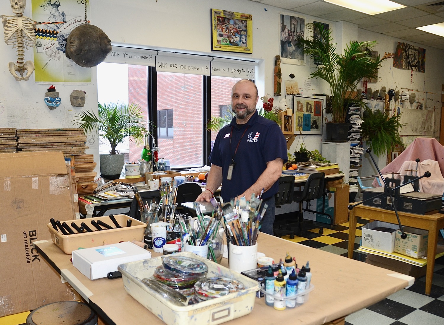 Pierson art teacher Joe Bartolotto said his negative interactions with students have gone down 90 percent since the school adopted the Yondr system, which prevents students from accessing their cellphones during the school day. KYRIL BROMLEY