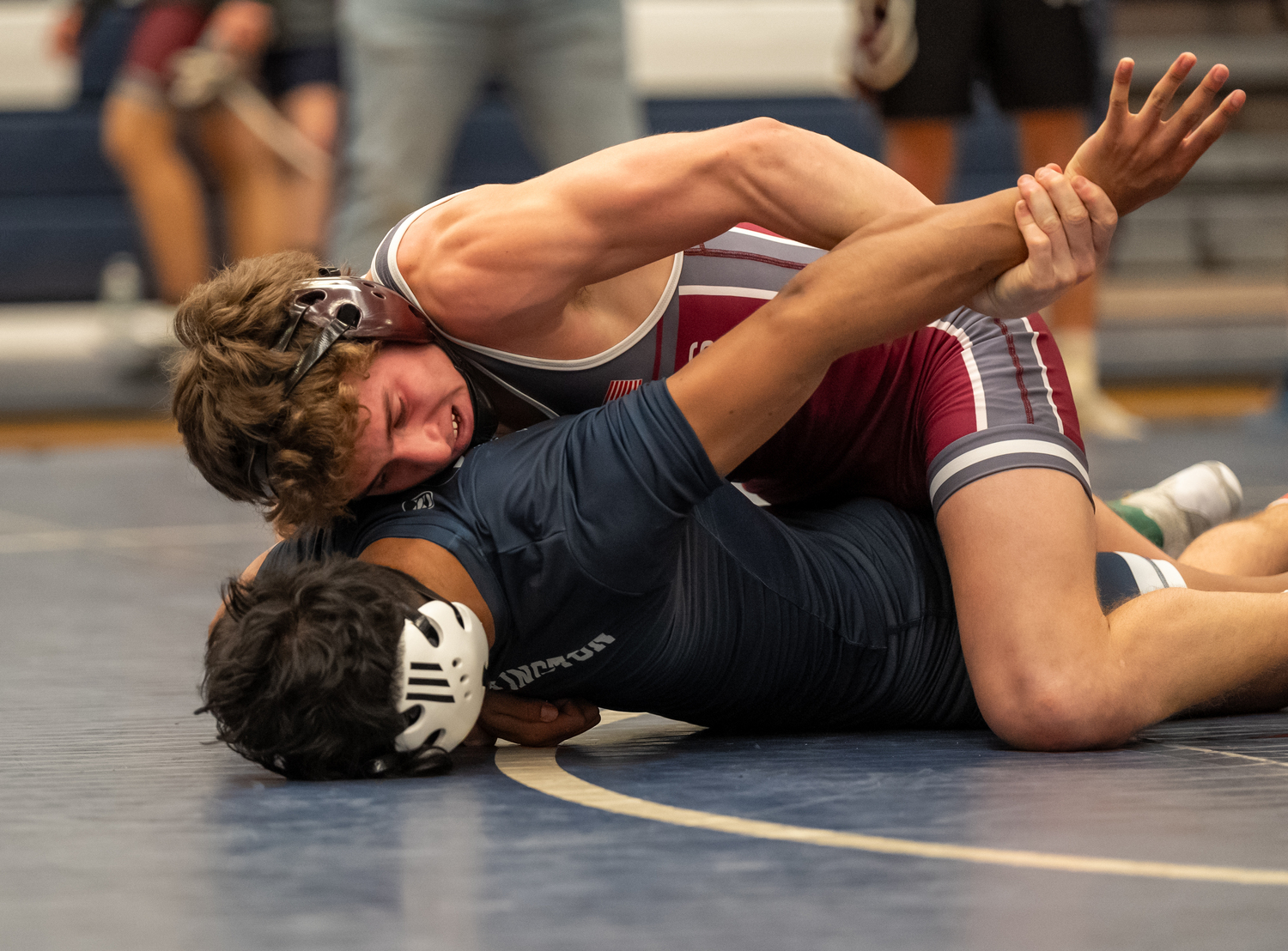 East Hampton's Luke Castillo battling Huntington's Brandon Canas in the quarterfinals of the 145-pound weight class, which Castillo won by pin.   RON ESPOSITO