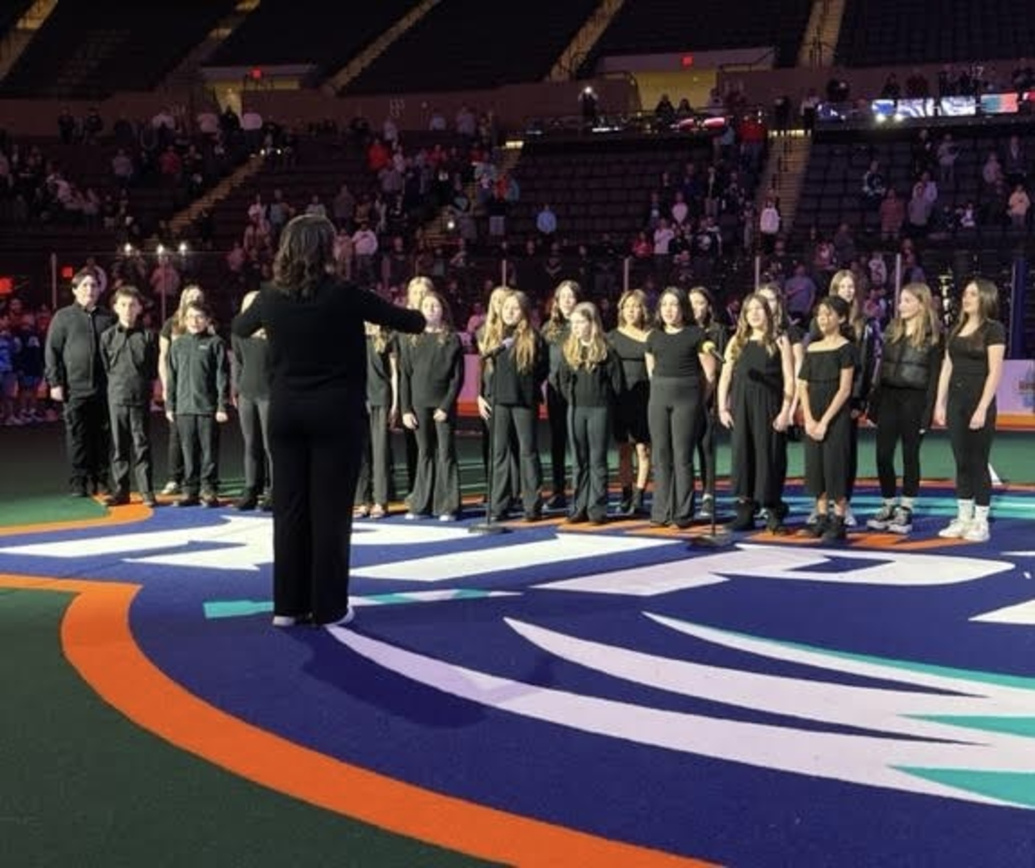 Eastport-South Manor Central School District choral instructor Cara Navaretta and students from Dayton Avenue and Eastport Elementary schools performed the national anthem at the New York Riptide game in Nassau Coliseum. COURTESY EASTPORT-SOUTH MANOR SCHOOL DISTRICT