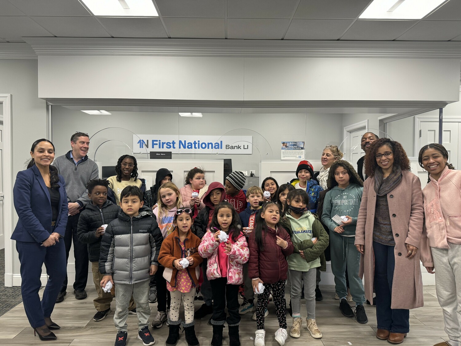 The Bridgehampton Child Care and Recreational Center is partnering with First National Bank's East Hampton branch to teach children about financial literacy. last Friday, the children opened their own savings accounts. COURTESY BRIDGEHAMPTON CHILD CARE AND RECREATIONAL CENTER