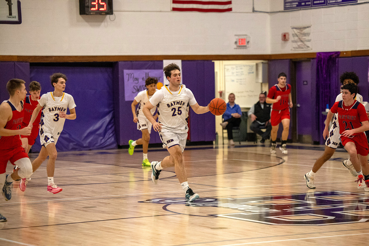 Senior forward Isaiah Lattanzio carries the ball down the court. MICHAEL O'CONNOR