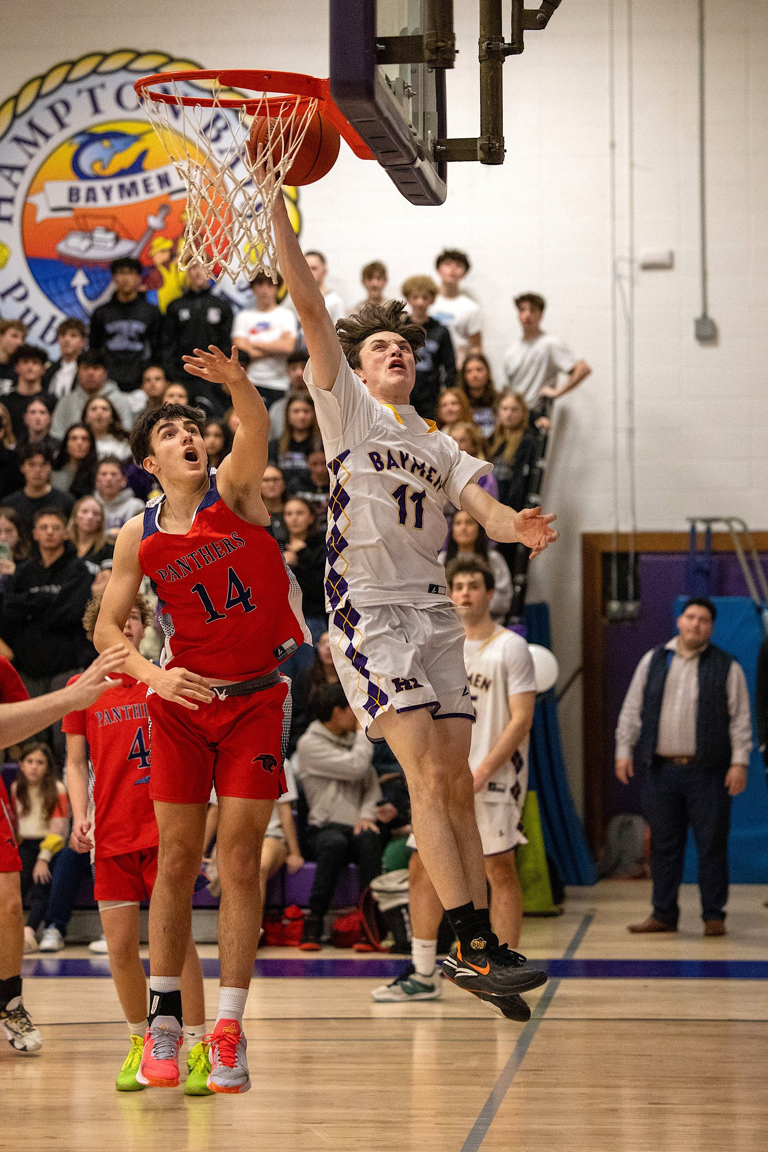 Senior guard and forward Patrick Donahue reaches for the rim. MICHAEL O'CONNOR