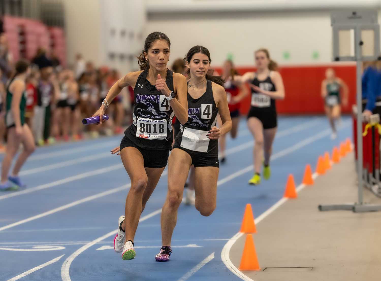 Sofia Galvan takes off after taking the baton from Izzy Ospitale in the 4x200-meter relay.   RON ESPOSITO