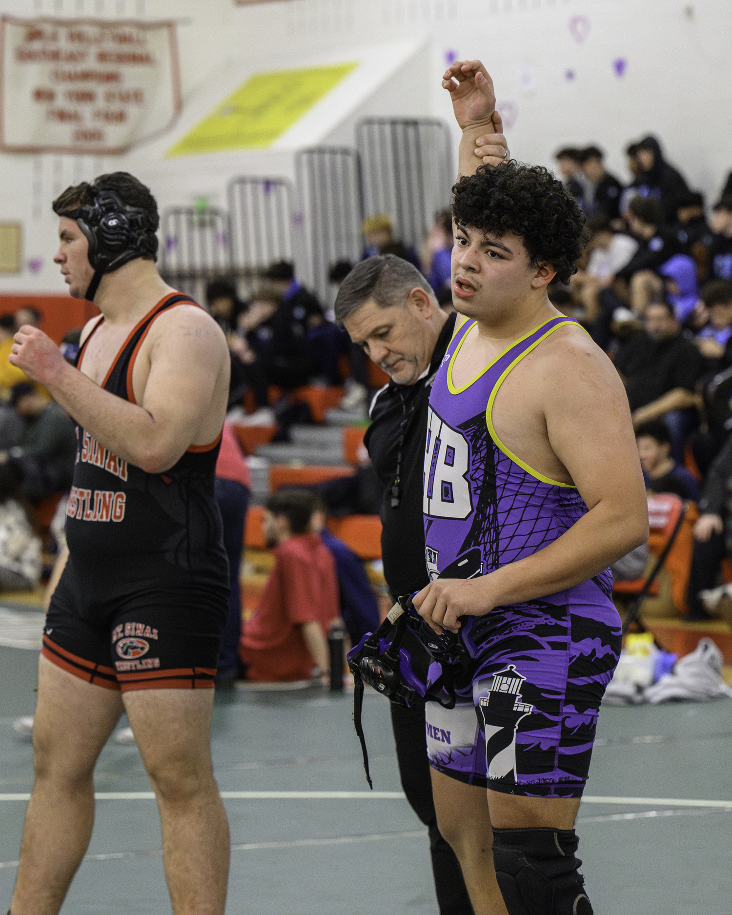 Michael Gutierrez of Hampton Bays gets his arm raised after defeating Mount Sinai's Devin Champaine in the consolation semifinals.   MARIANNE BARNETT