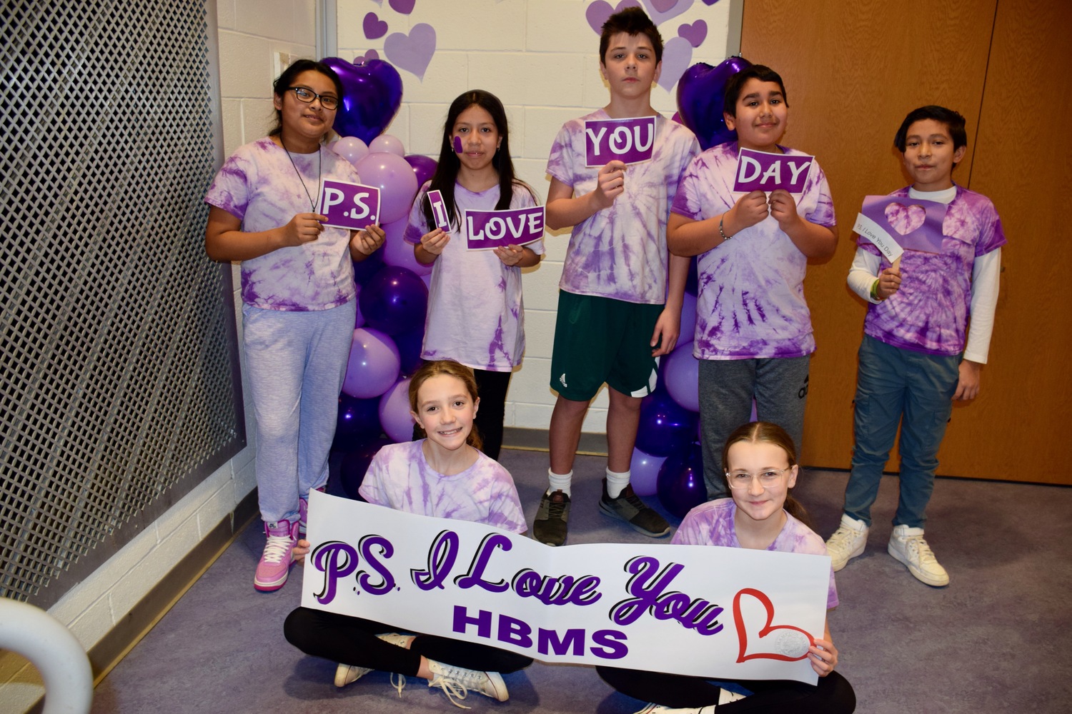 Hampton Bays Middle School students celebrated P.S. I Love You Day on Feb. 9 to raise awareness about bullying and suicide while promoting kindness. The students embraced the theme by showing kindness to their peers. They wrote positive messages on Post-it notes, created displays in their hallways and wore purple. They also formed a large heart for a group photo in the school’s gym. COURTESY HAMPTON BAYS SCHOOL DISTRICT
