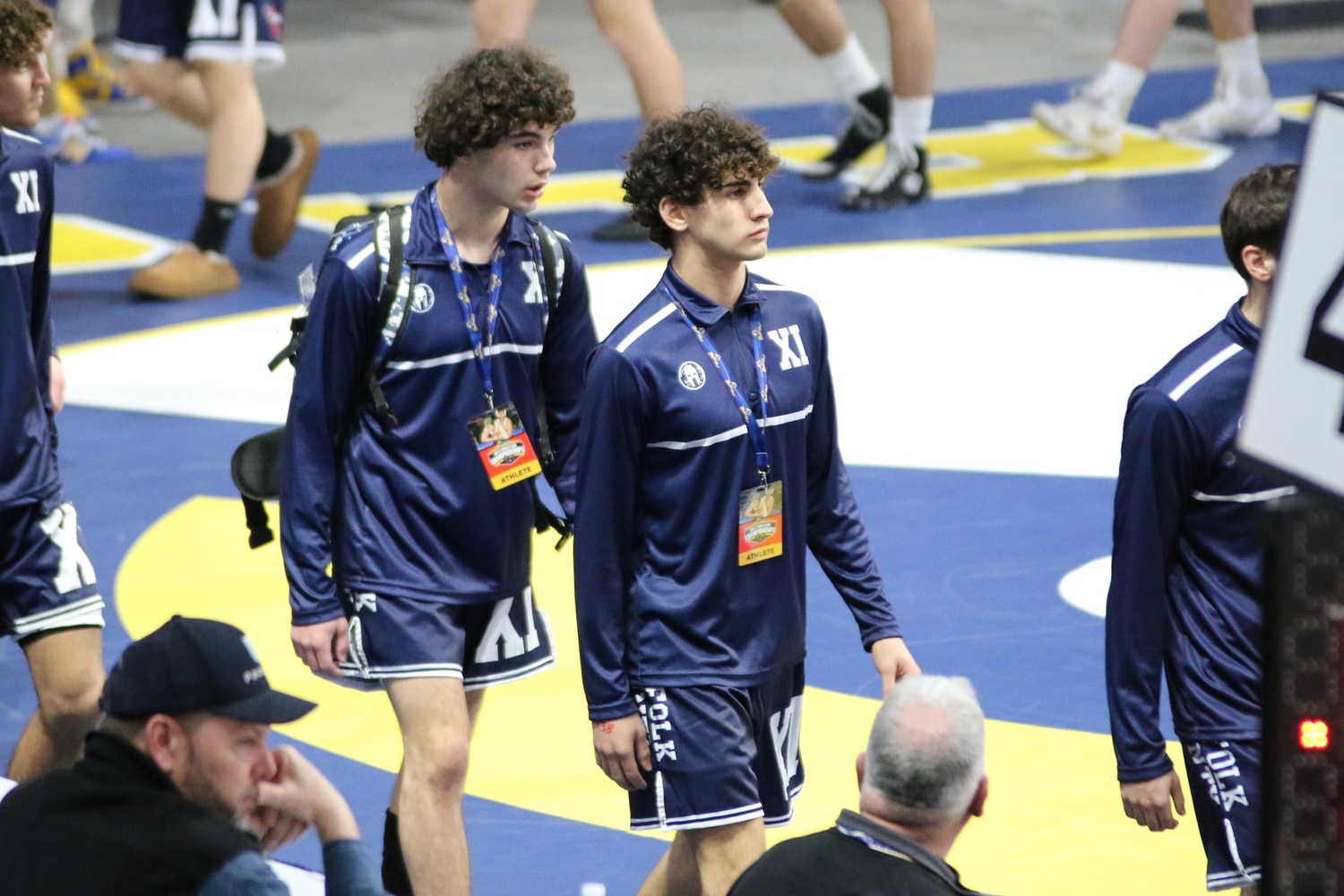 Mariners Liam Squires, left, and Jack Nastri as part of the parade of champions at the start of the state tournament this past weekend.   ERIC NASTRI