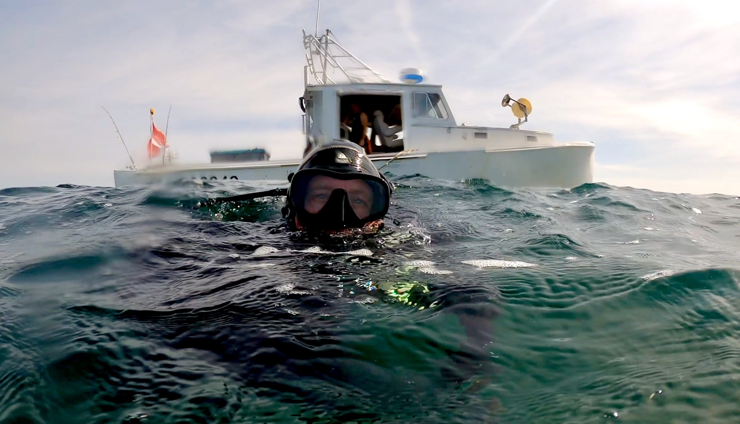 Diving lobsterman Michael Packard and his boat in a scene from David Abel's new documentary 