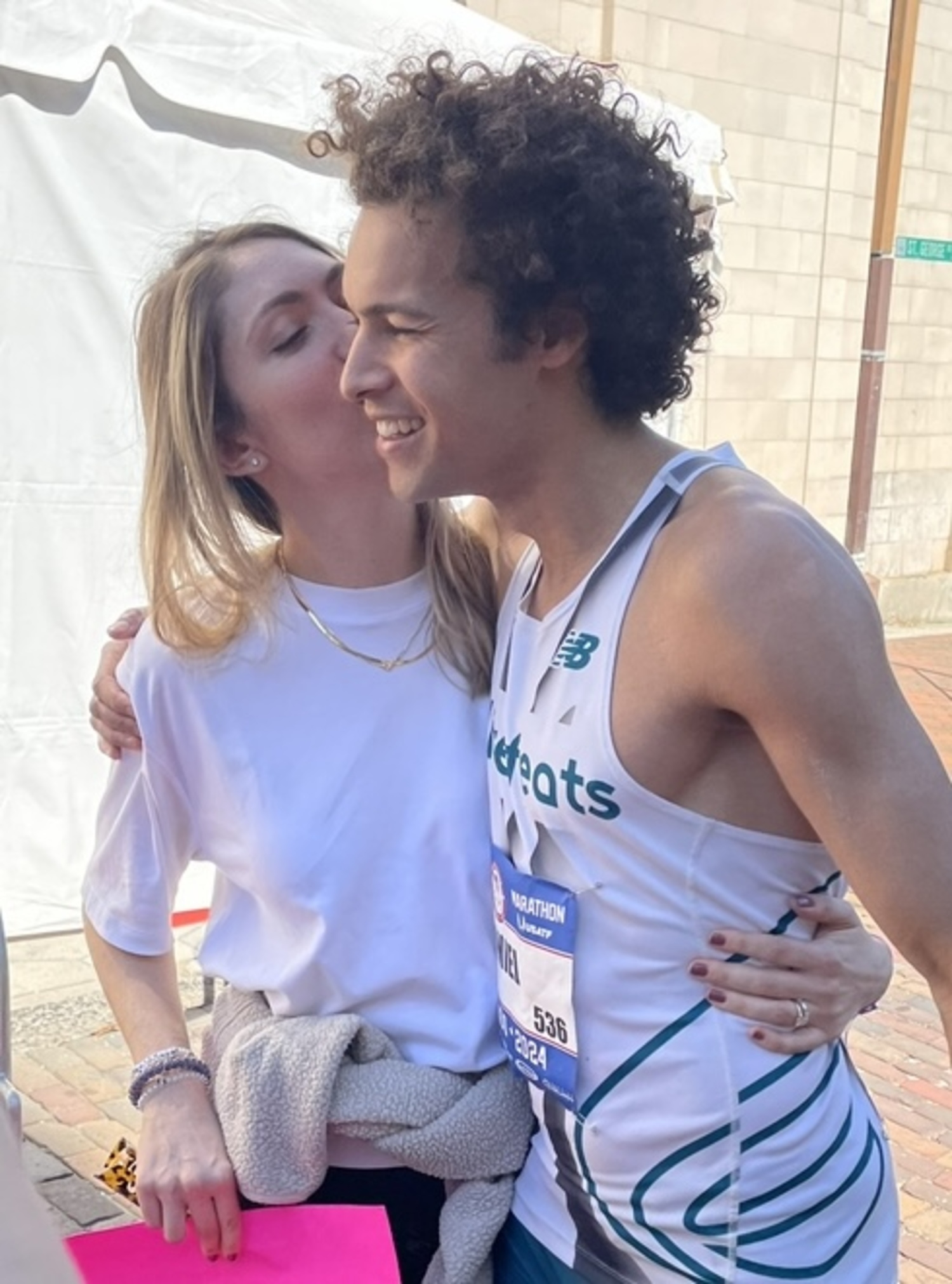 Jordan Daniel is greeted by his wife, Crista, after the race.   COURTESY JORDAN DANIEL