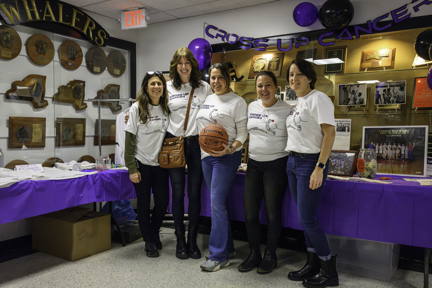 The group who helped organize Friday night's Cross Up Cancer event included, from left, Donna Butler, Deirdre Seltzer, Laura Smith, Janet Mancino and Karin Schroeder.   MARIANNE BARNETT