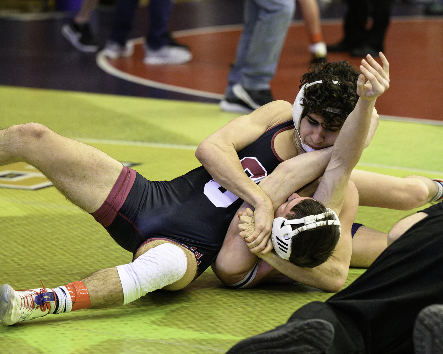 Southampton senior Jack Nastri with a headlock on Port Jefferson's Cade Delgado who he pinned in the first period of the match for 
