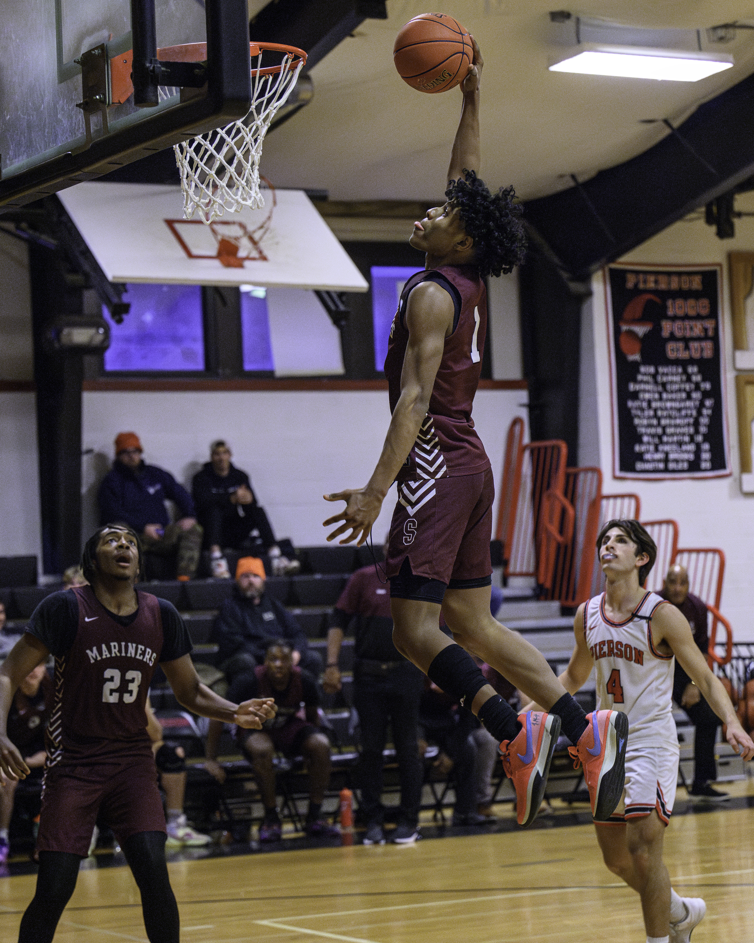 Senior Mariner Dominick White gets up for another dunk.   MARIANNE BARNETT