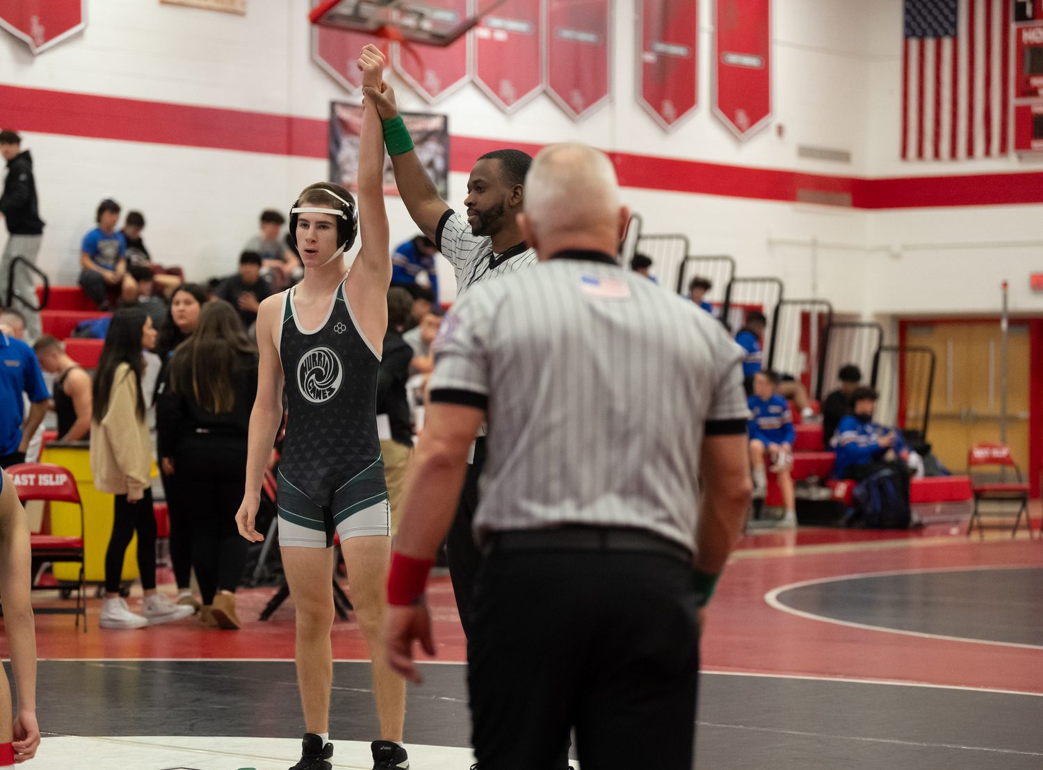 Tadhg Green gets his arm raised after winning his first round match on Saturday. RON ESPOSITO