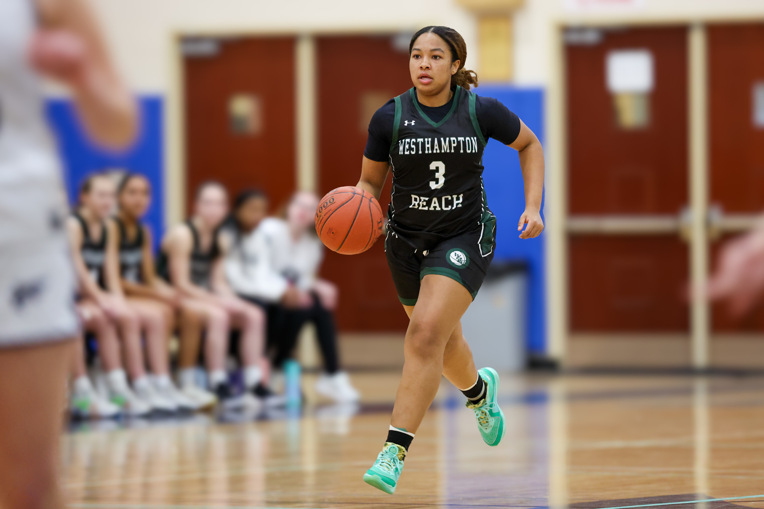 Sophomore point guard Sandra Clarke carries the ball down the court. RON ESPOSITO