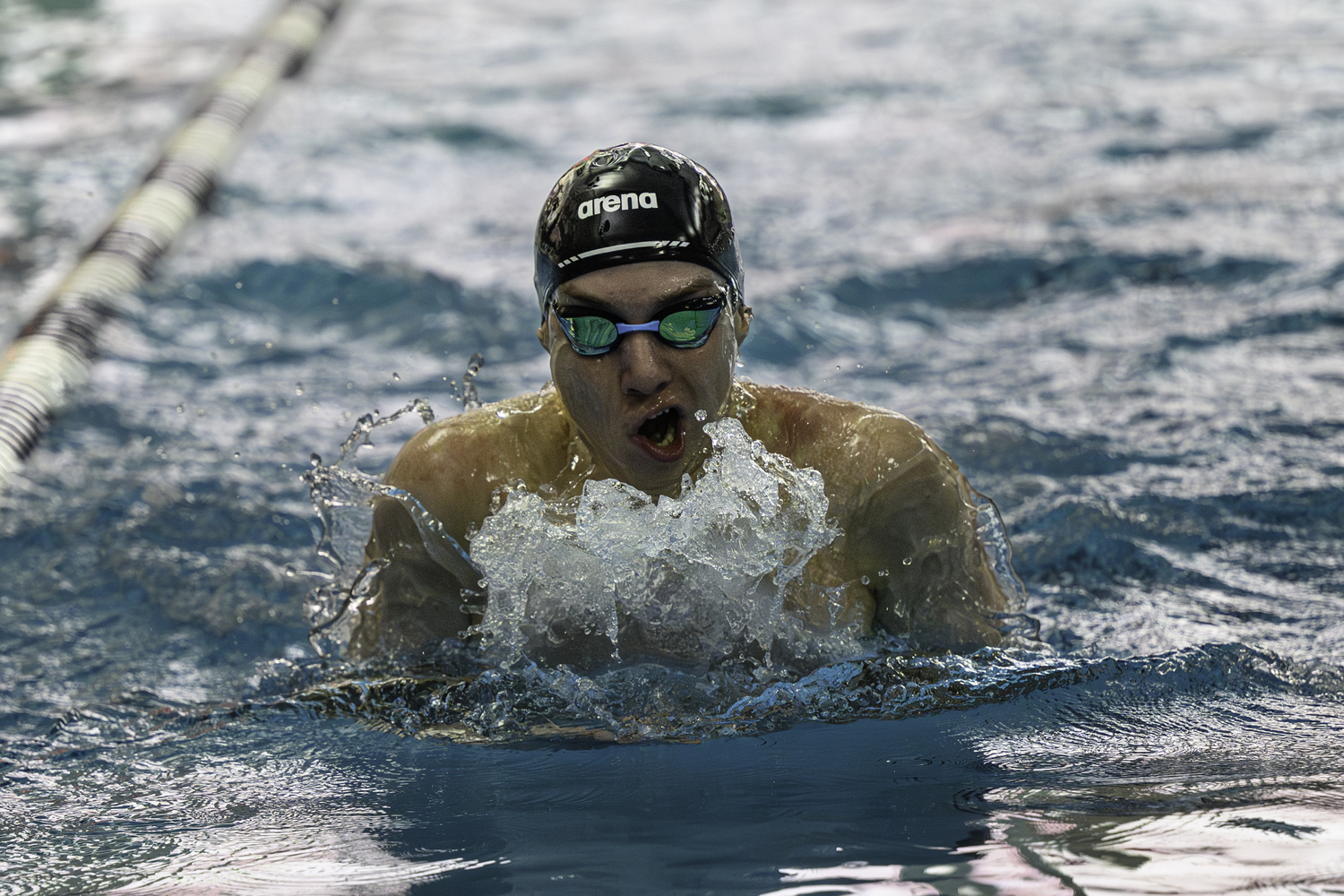 Westhampton Beach senior Max Buchen swam the 100-yard breaststroke in a personal best 54.26 seconds for first place at the Suffolk County boys swimming championships at Stony Brook University February 10. Buchen also placed first in the 200 individual medley (1:52.31). MARIANNE BARNETT