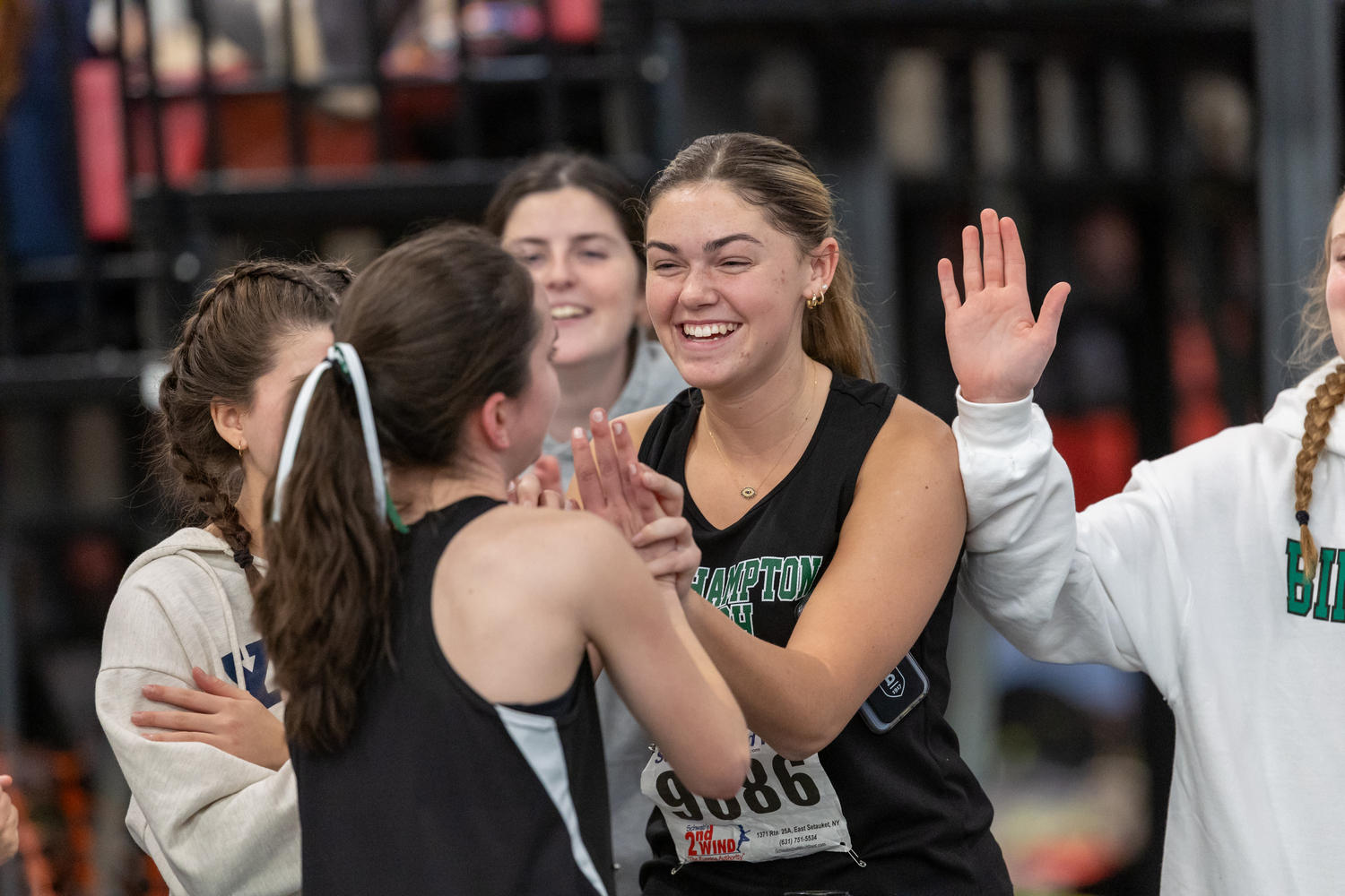 Gabby Wendel and other teammates congratulate Lily Strebel after her victory in the 1,500-meter race.   RON ESPOSITO