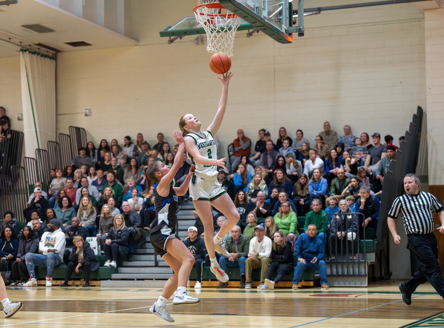 Westhampton Beach senior Sarah Gormley finishes off a fast break with a layup. She finished with six points, six rebounds, four assists and two steals.   RON ESPOSITO