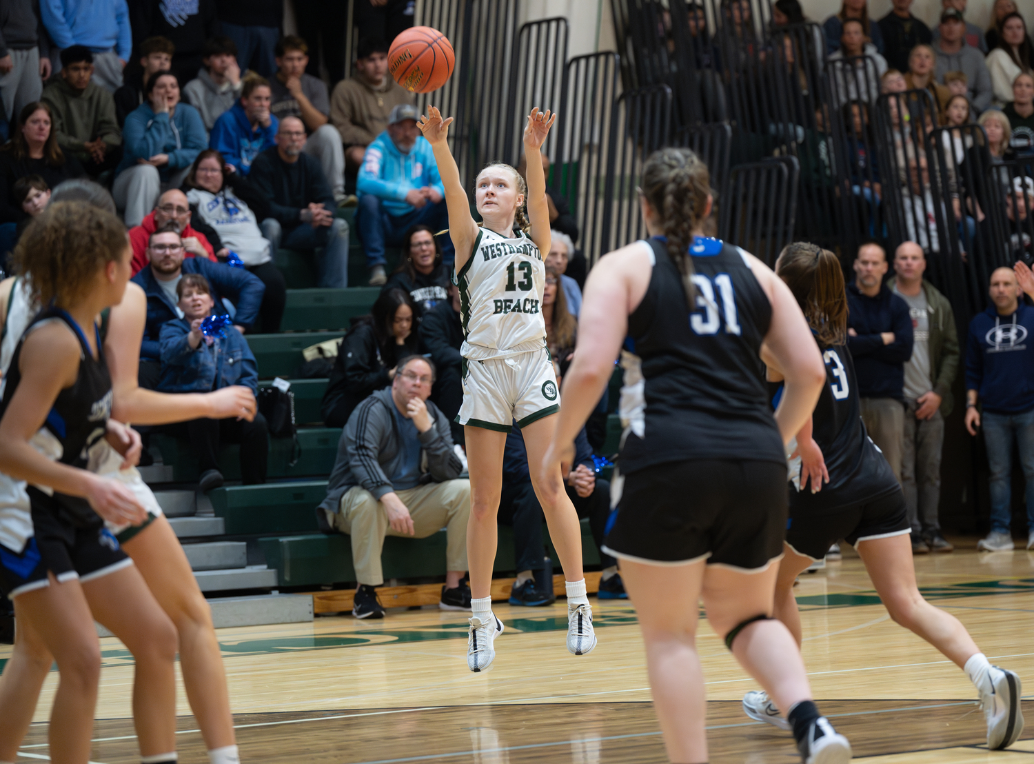Westhampton Beach freshman Kate Sweet shoots a three. She was second on the team in scoring on Friday night with 11 points.   RON ESPOSITO
