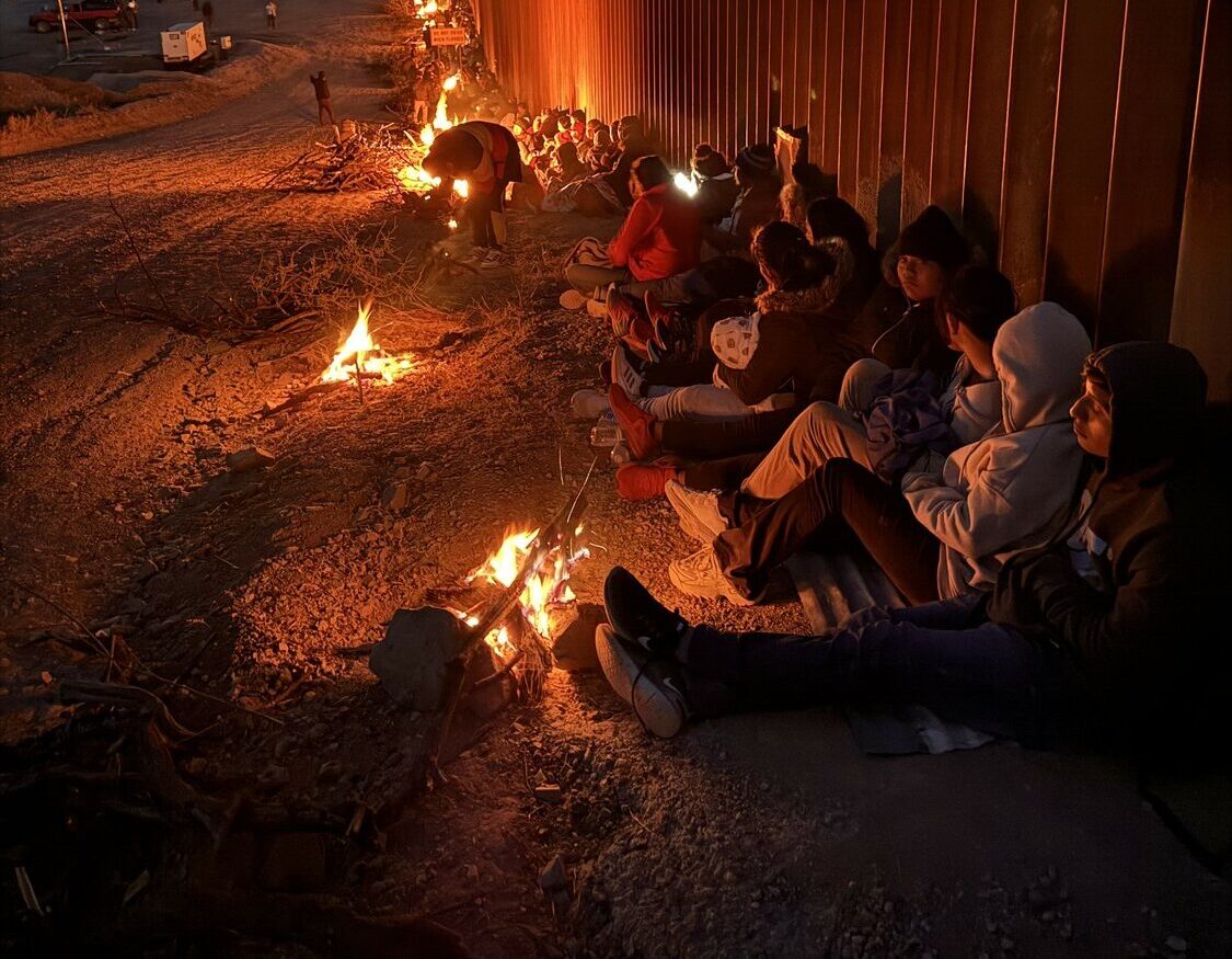Asylum seekers camp out along the border wall outside Sasabe, Arizona. COURTESY ELISSA MCLEAN AND ANDY WINTER