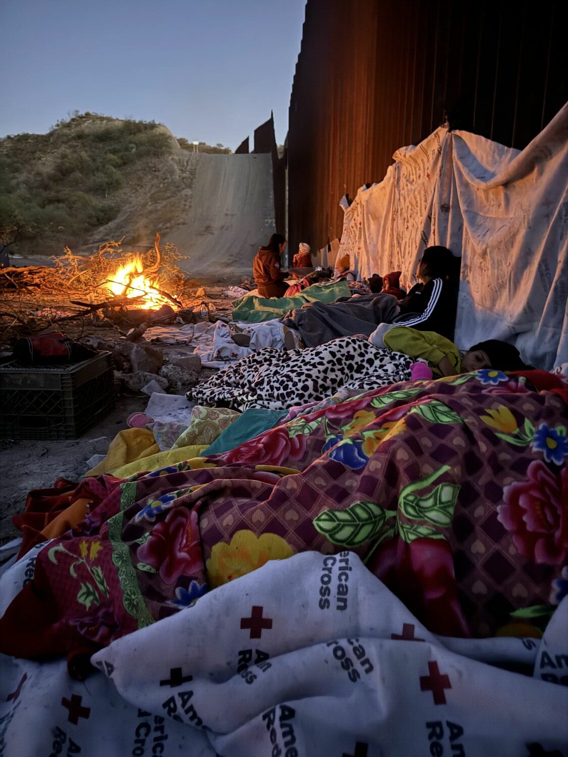 Asylum seekers camp out near the border wall outside Sasabe, Arizona. COURTESY ELISSA MCLEAN AND ANDY WINTER