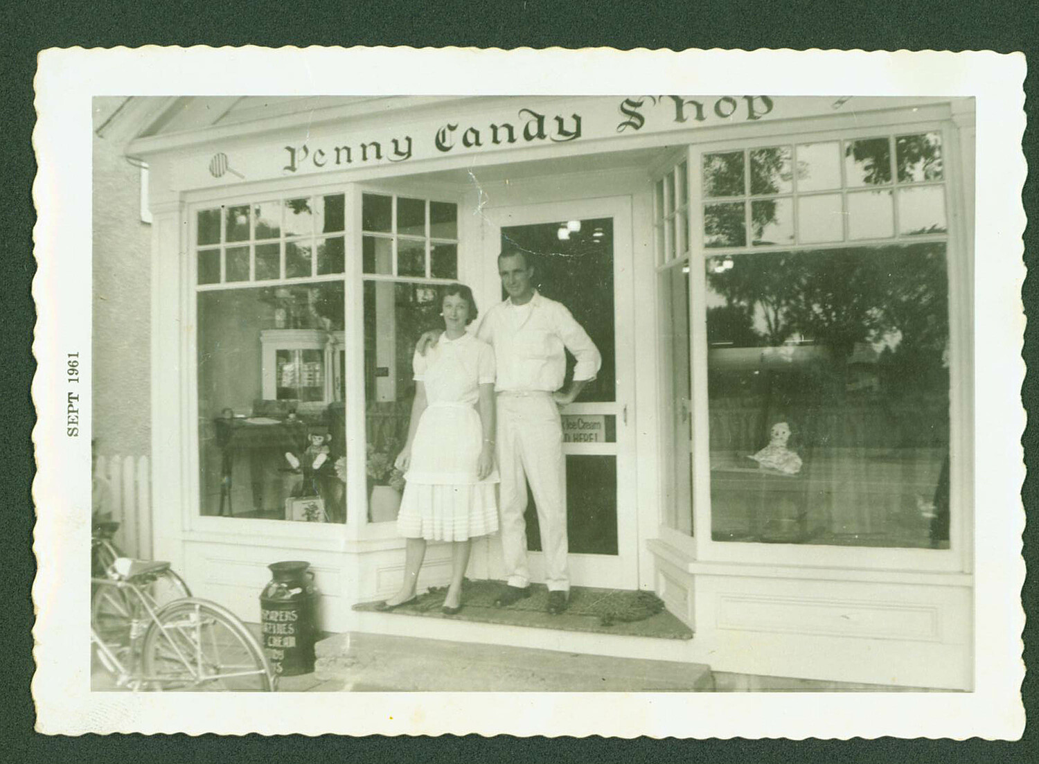 June and Harvey Morris photographed by Charlie Muller at the opening in front of the Penny Candy Shop on September 11 of 1961.