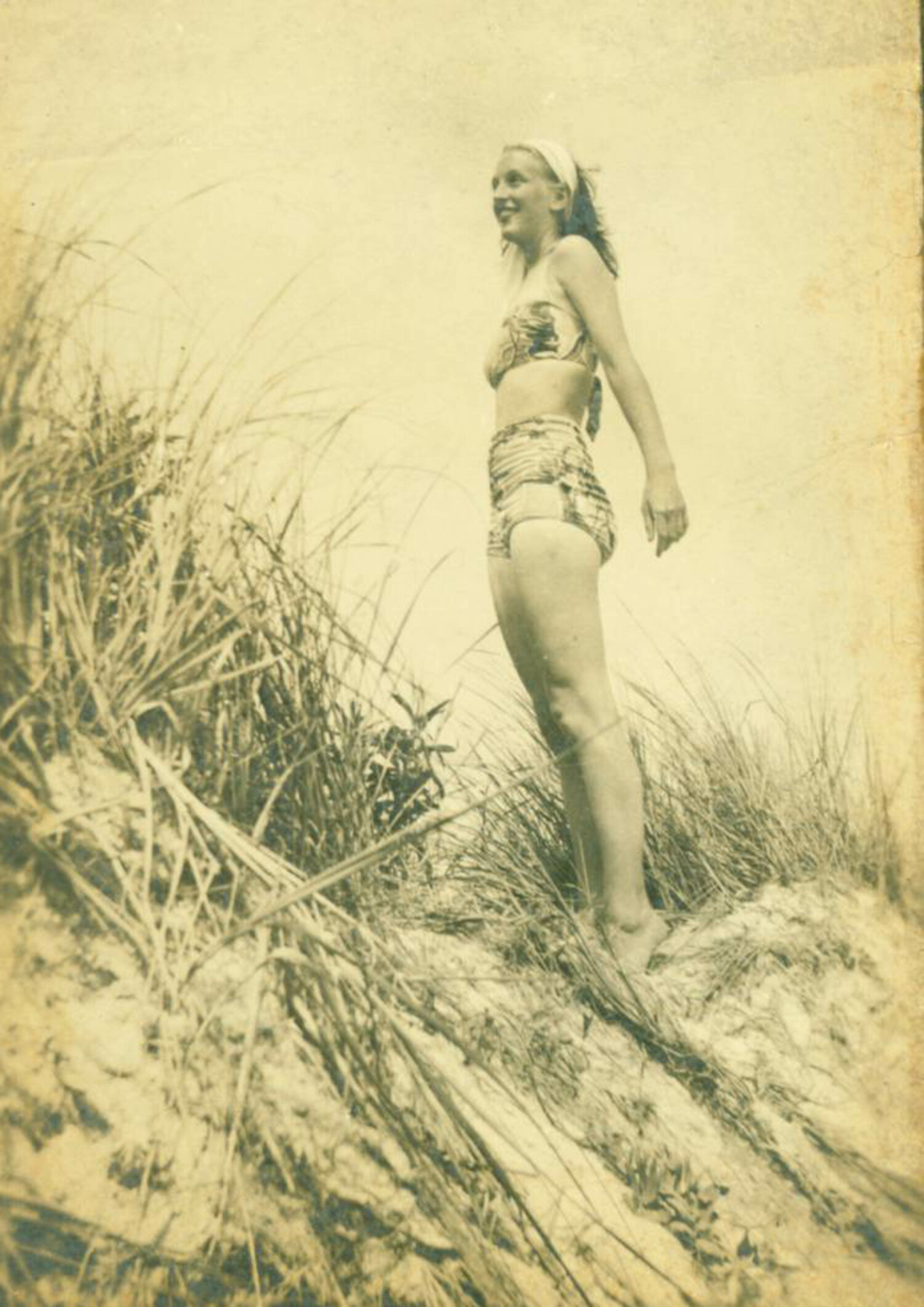 June Morris, just out of high school, on the beach at Fire Island.