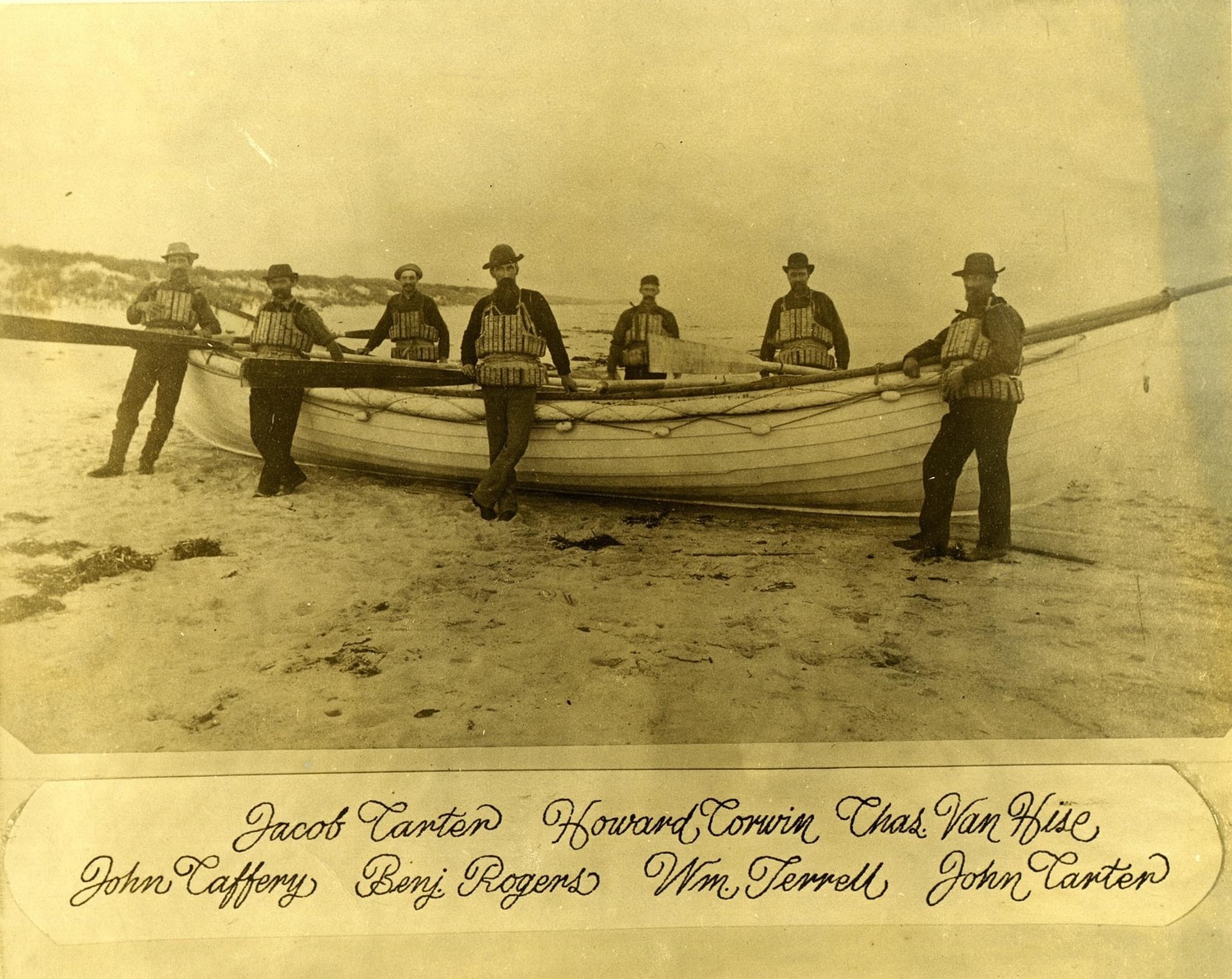 An old photo with some of the former crewmembers, their names listed below the photo. EAST QUOGUE HISTORICAL SOCIETY