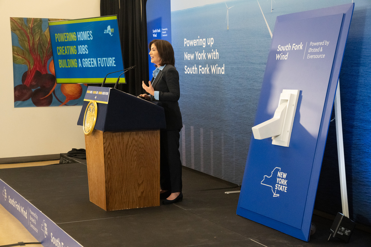Governor Kathy Hochul at the event last week prepares to flick the giant switch. COURTESY DON POLLARD/OFFICE OF GOVERNOR KATHY HOCHUL