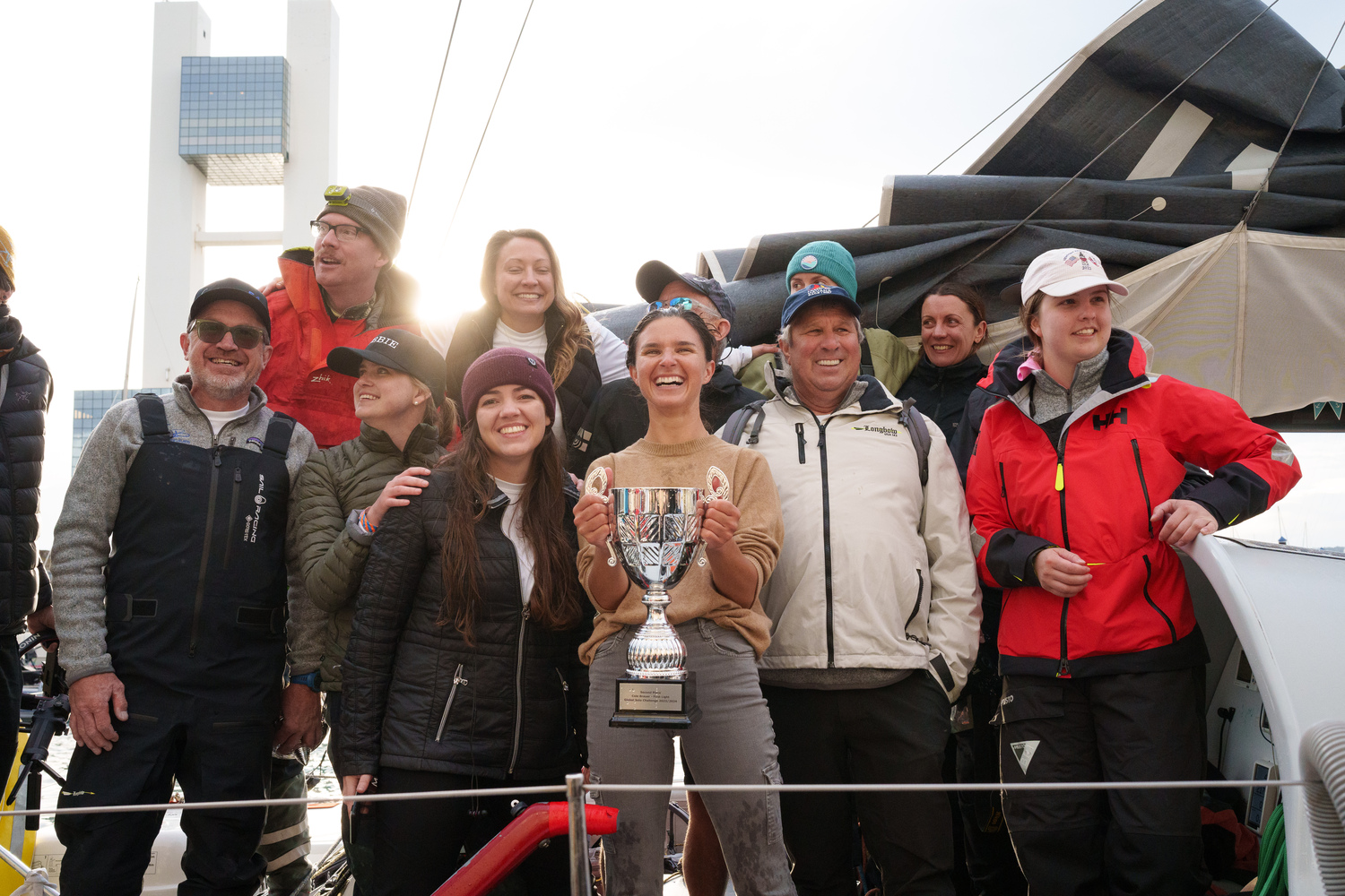 Cole Brauer hoists up her silver trophy for finishing second in the Global Solo Challenge. ALVARO SANCHIS