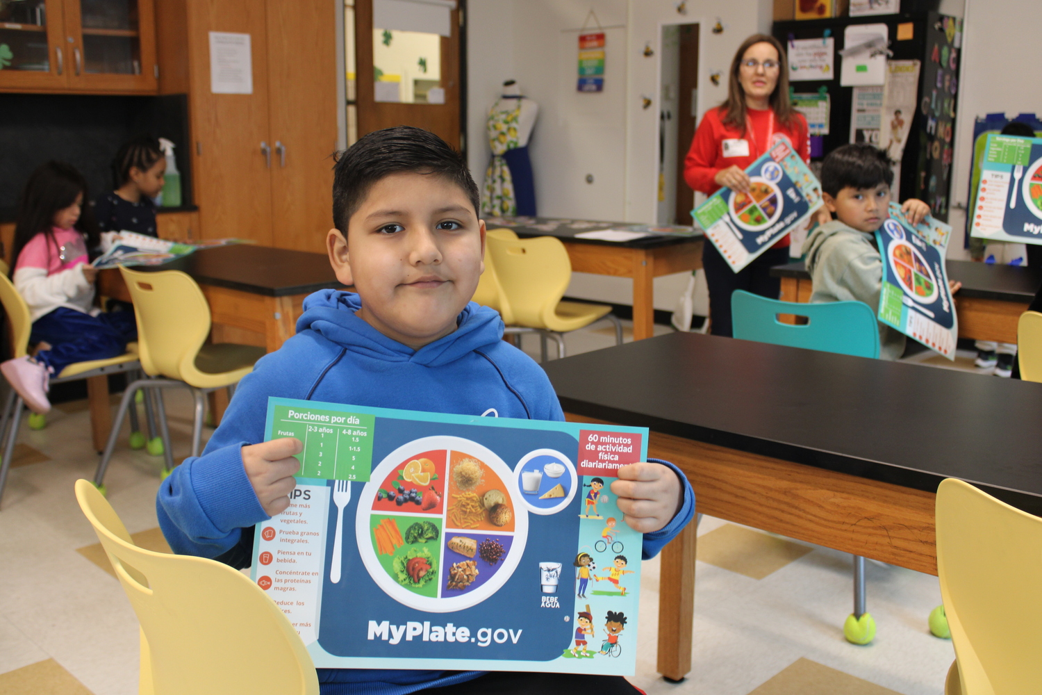 Bridgehampton School second-grader Jacob Lazaro with his MyPlate.gov’s place mat. The mats are being used in a wellness initiative. COURTESY BRIDGEHAMPTON SCHOOL