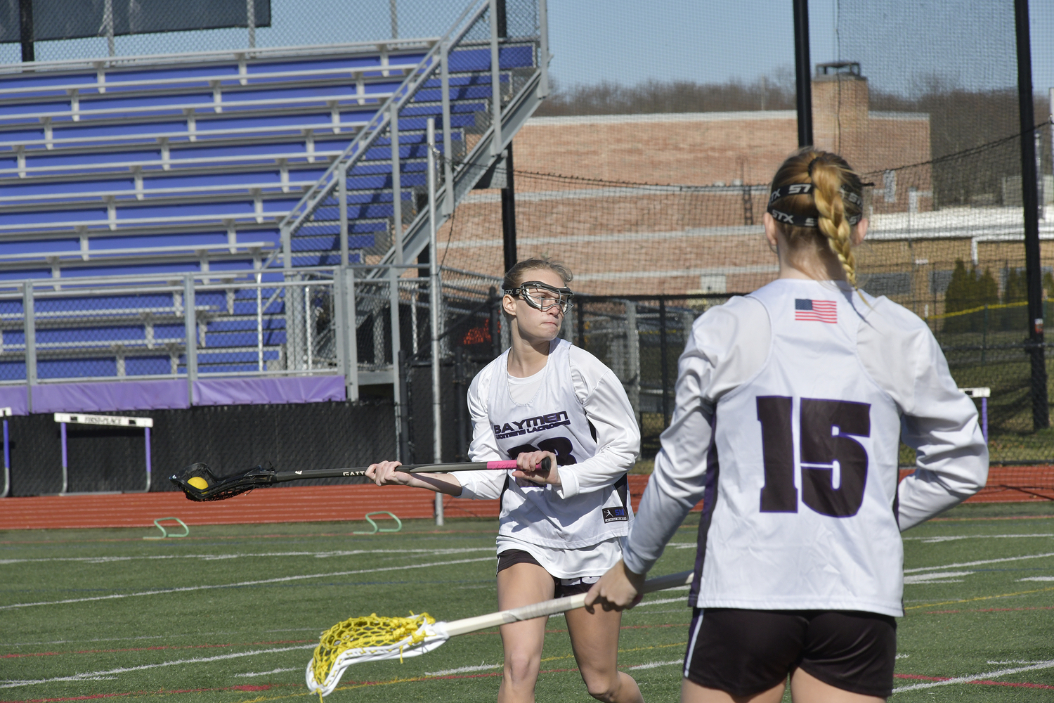 Members of the Hampton Bays girls lacrosse team practice prior to their scrimmage against the Stony Brook School on Monday.  DANA SHAW