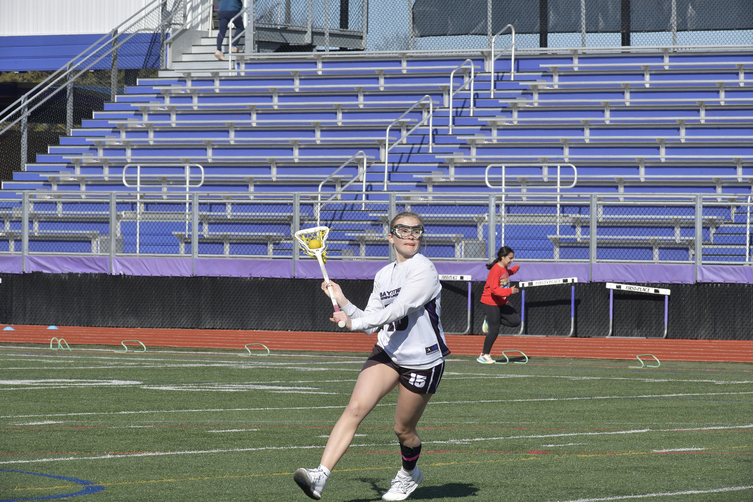 Members of the Hampton Bays girls lacrosse team practice prior to their scrimmage against the Stony Brook School on Monday.  DANA SHAW