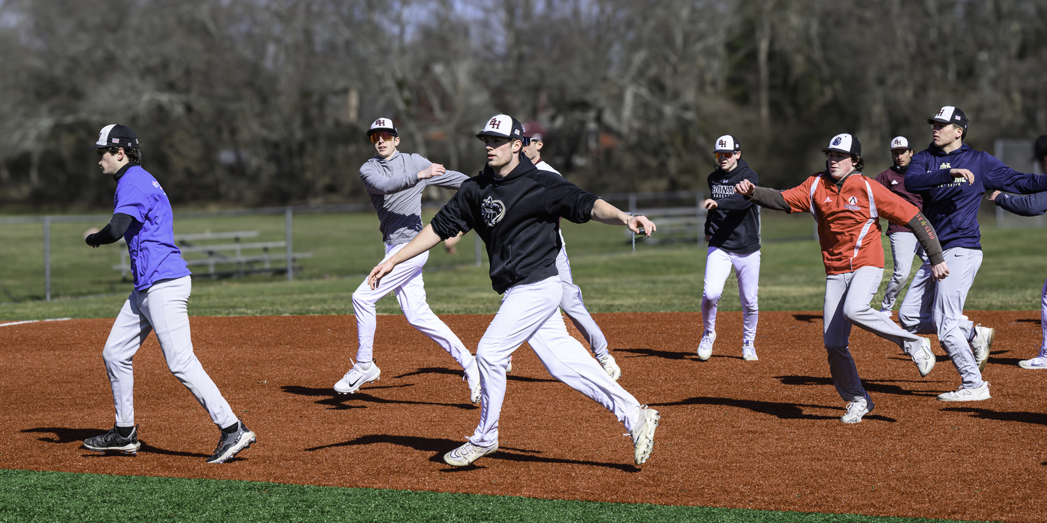 East Hampton baseball warms up on the first day of practice on March 11.  MARIANNE BARNETT