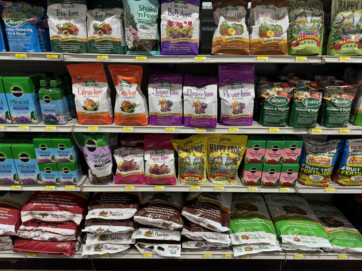 Even more fertilizer choices as we move down the aisle. Interestingly, only three of all these products tell us on the front of the bag or box what the fertilizer content ratio of nutrients is. One is an organic 6-4-5, another is 4-9-3 and the third is a pure chemical 10-10-10.  ANDREW MESSINGER