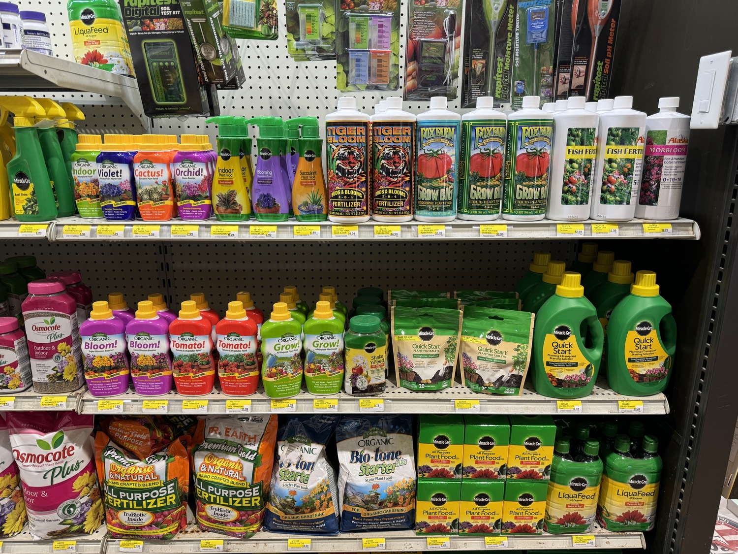 Just one of the three 20-foot-longshelves of fertilizers at a garden center. Each container must state the formulation (N-P-K) of fertilizer it contains, but it’s not always easy to find. Do you know which products in this photo are chemical based and which are organic? Usually the word 