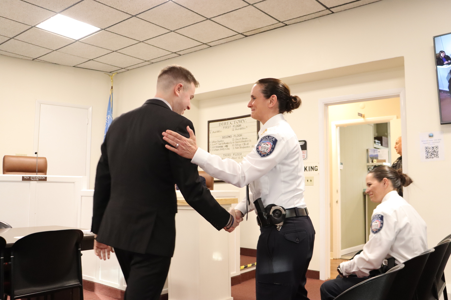 Southampton Village Police Chief Suzanne Hurteau congratulates Officer John Sganga for being promoted to a full-time Southampton Village Police Officer. CAILIN RILEY