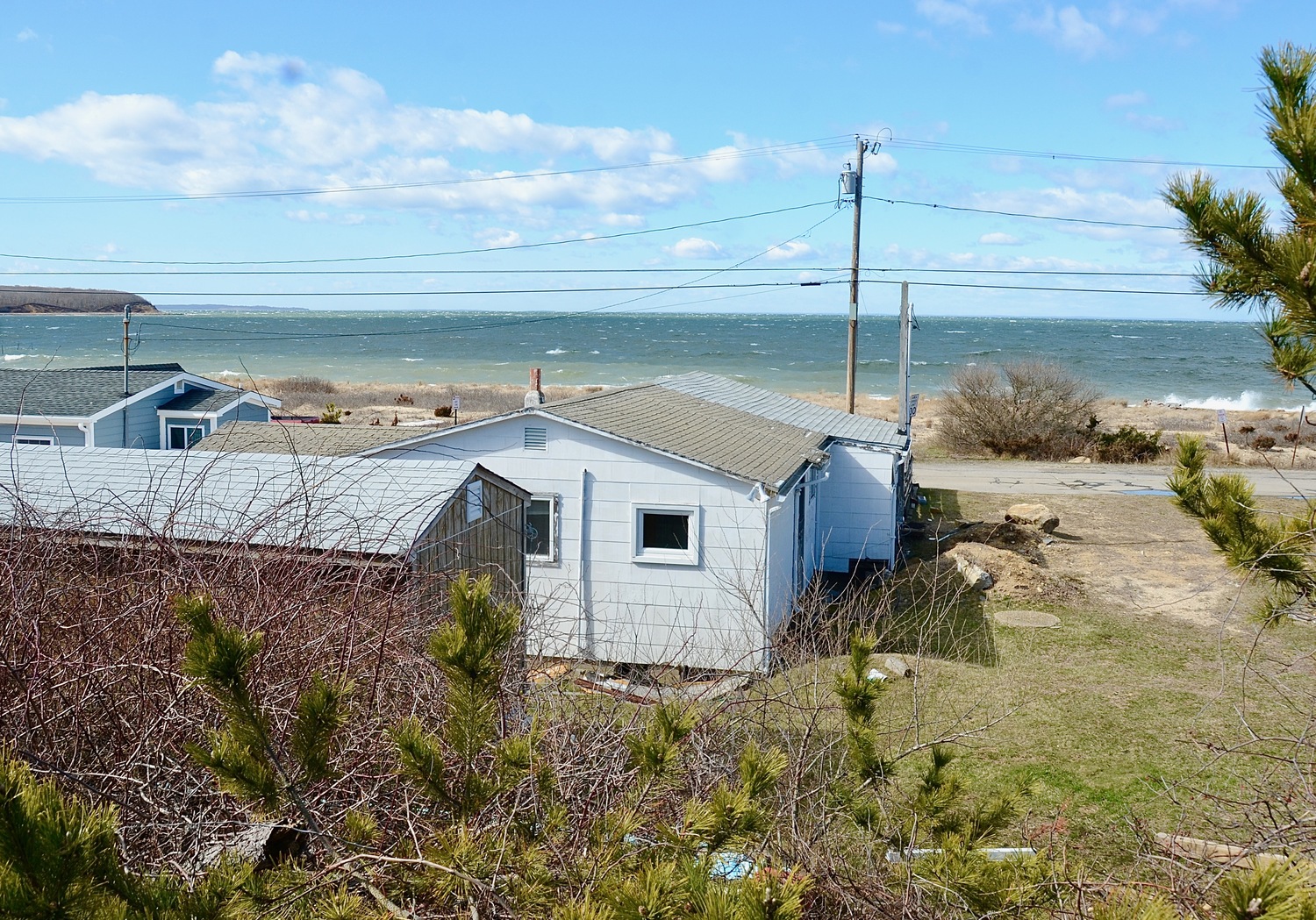 East Hampton Town has agreed to purchase a tiny Navy Road parcel, less than 2-tenths of an acre in size, for just over $1 million. The ramshackle cottage on the land now will be razed by the current owner before handing the land over to the town. KYRIL BROMLEY