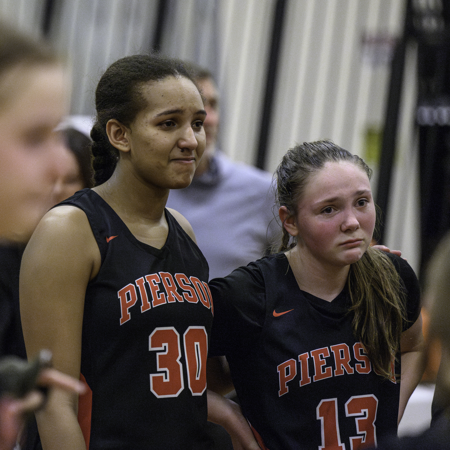 Lyra Aubry, left, and Cali Wilson in the Whalers' final huddle of the season after their playoff loss at Babylon on February 28.   MARIANNE BARNETT