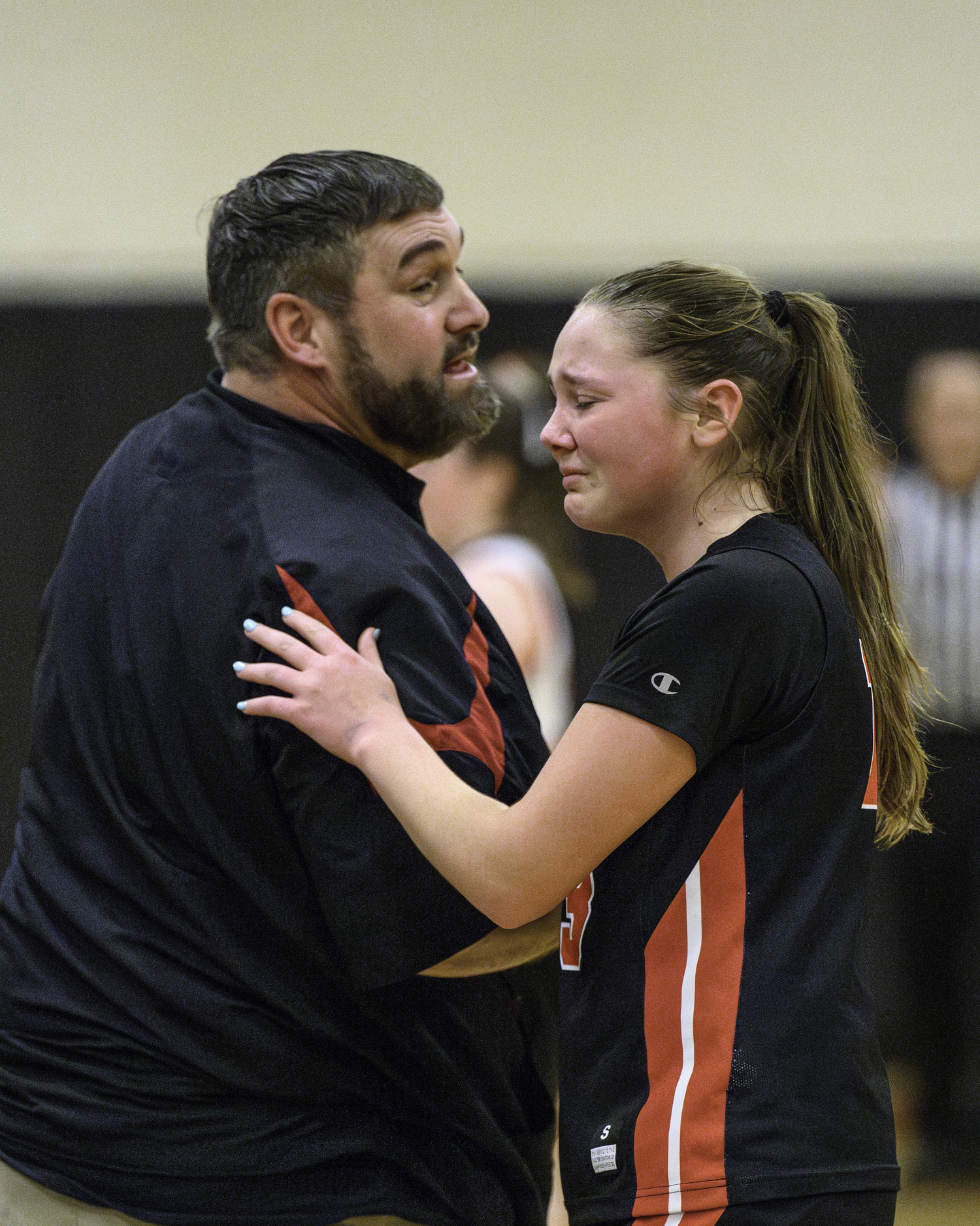 Whalers head coach Woody Kneeland consoles an emotional Cali Wilson toward the end of last week's playoff game in Babylon.   MARIANNE BARNETT