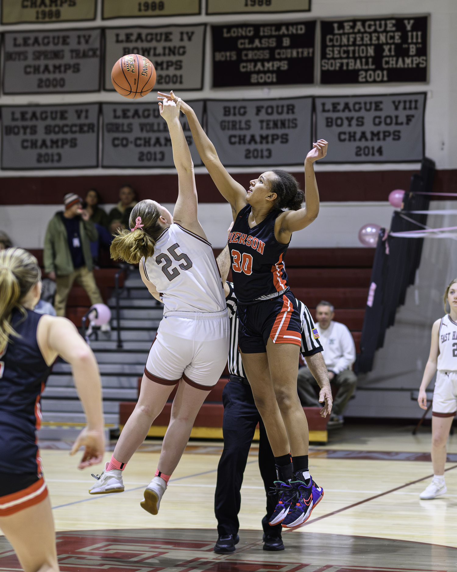 Pierson senior center Lyra Aubry reaches for the ball off the opening tipoff. MARIANNE BARNETT