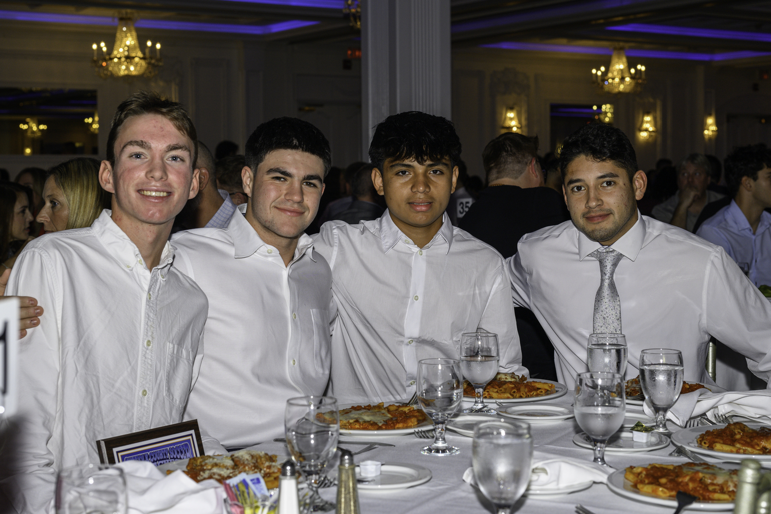 Whalers Ryder Esposito, left, Gus Hayes, Wilmer Reyes and head coach Luis Aguilar at the Suffolk County Boys Soccer Coaches Association dinner held at Villa Lombardi in Holbrook on December 18.   MARIANNE BARNETT