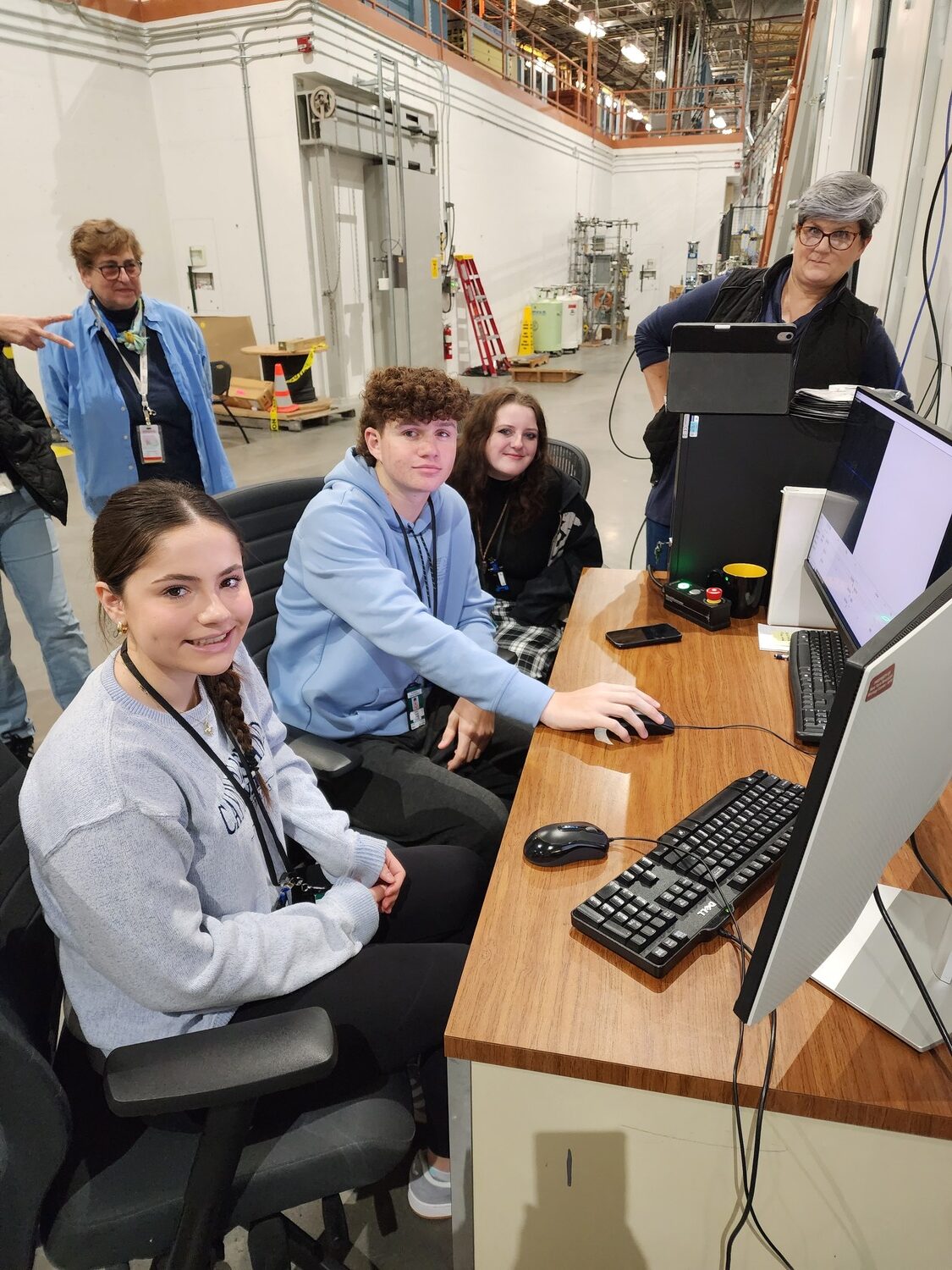 Eastport-South Manor Jr.-Sr. High School student-researchers Elaina Keller, James Lukas, Gianna Dalessandro and teacher Kelly Mackey from Islip High School with, left, beamline scientist Dr. Vivian Stojanoff during a recent visit to Brookhaven National Laboratory. Through their collaboration with Brookhaven National Laboratory’s SPARK Program, research students visited the National Synchrotron Light Source II at BNL to collect X-ray diffraction data on the protein beta lactamase. COURTESY EASTPORT-SOUTH MANOR SCHOOL DISTRICT