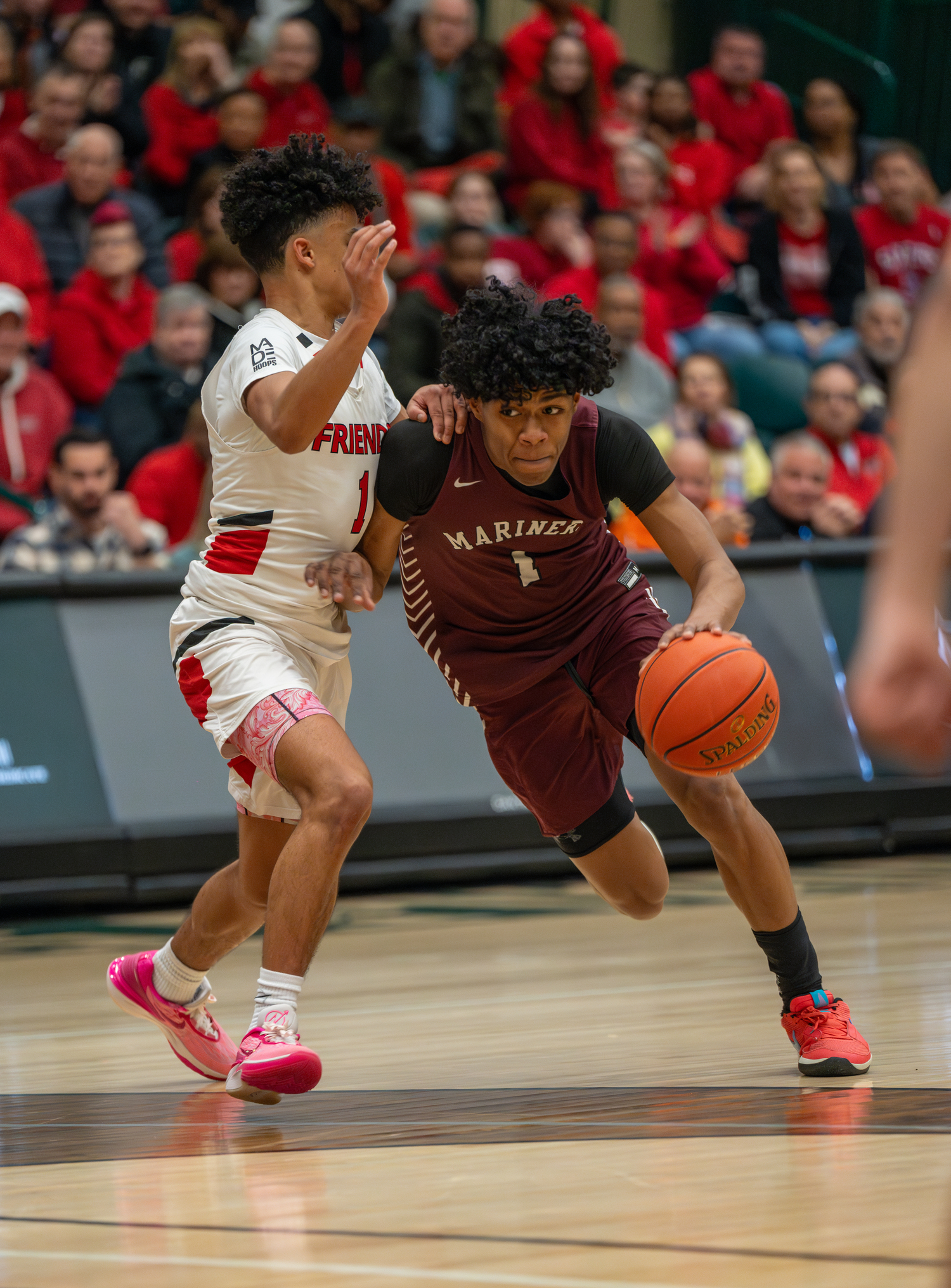 Southampton senior Dominick White drives on Friends Academy freshman Eyan Valadez.   RON ESPOSITO