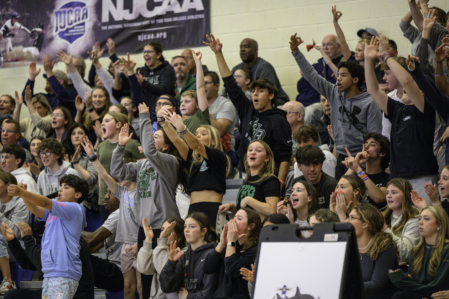 Westhampton Beach fans celebrate a Sandra Clarke three-pointer. MARIANNE BARNETT