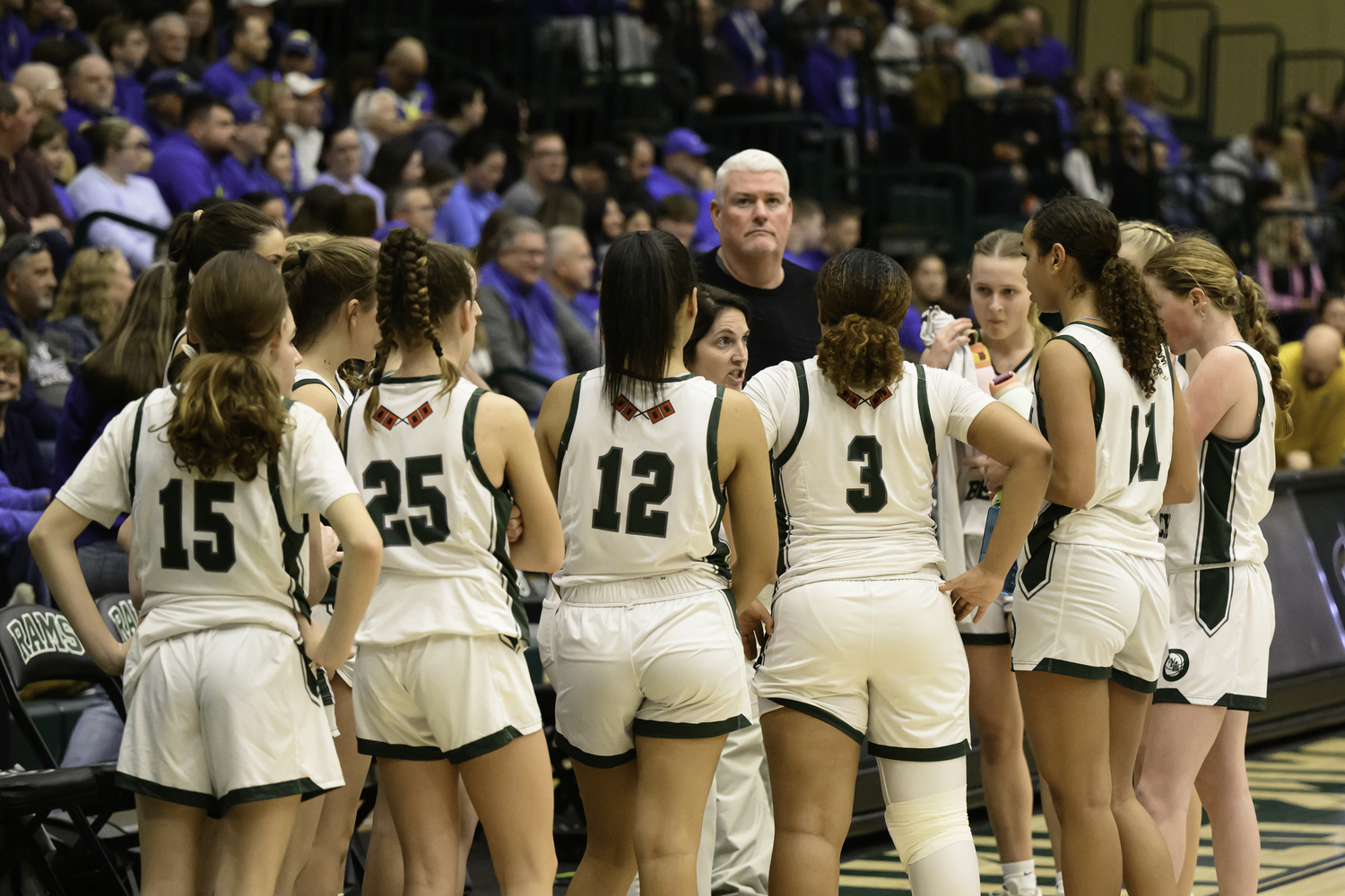 Westhampton Beach's girls basketball team in the huddle. MARIANNE BARNETT